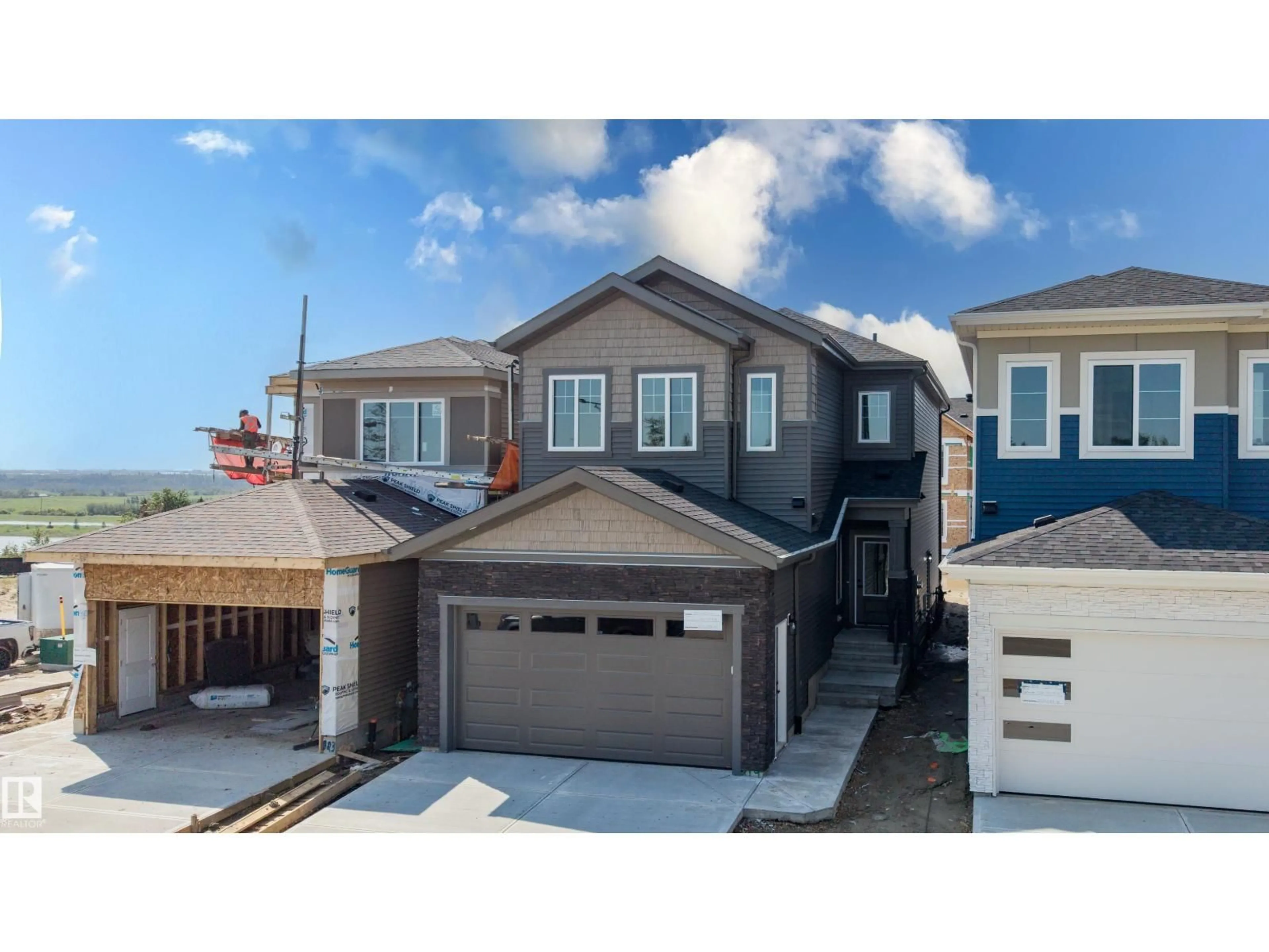 Home with vinyl exterior material, street for NE - 819 158 AV, Edmonton Alberta T5Y4M9