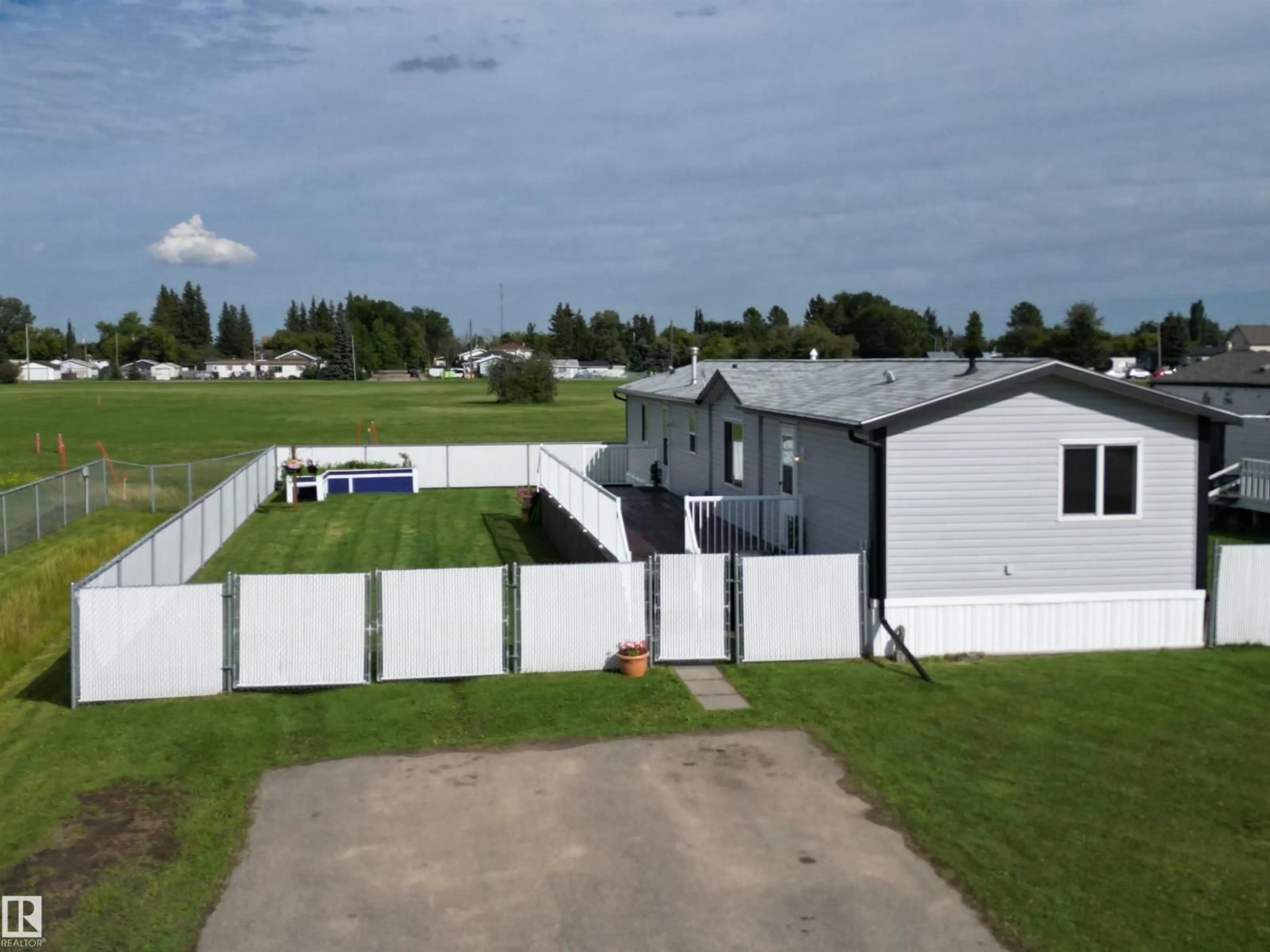 A pic from outside/outdoor area/front of a property/back of a property/a pic from drone, building for 41- - 5220 44 AV, Calmar Alberta T0C0V0