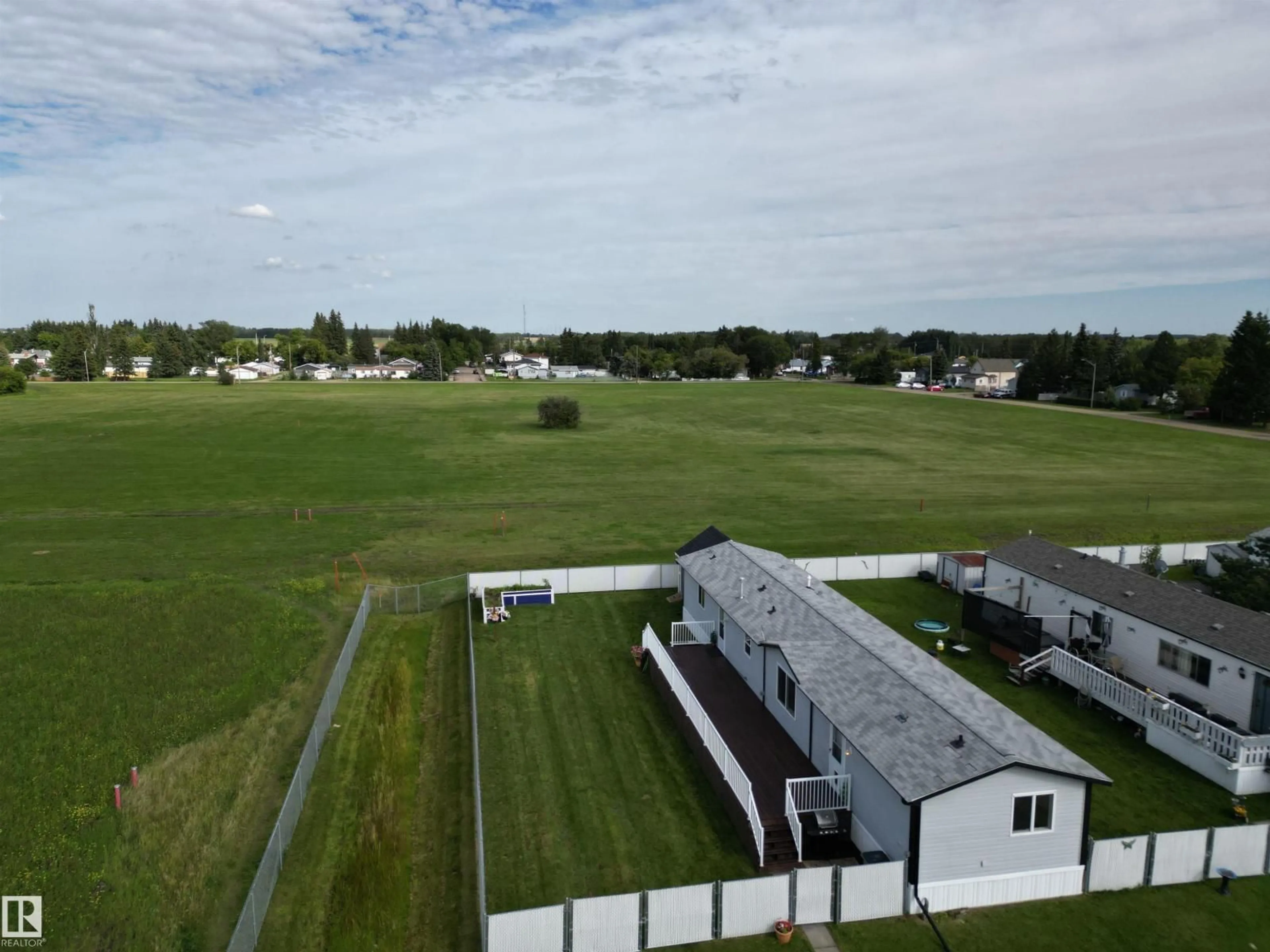 A pic from outside/outdoor area/front of a property/back of a property/a pic from drone, building for 41- - 5220 44 AV, Calmar Alberta T0C0V0