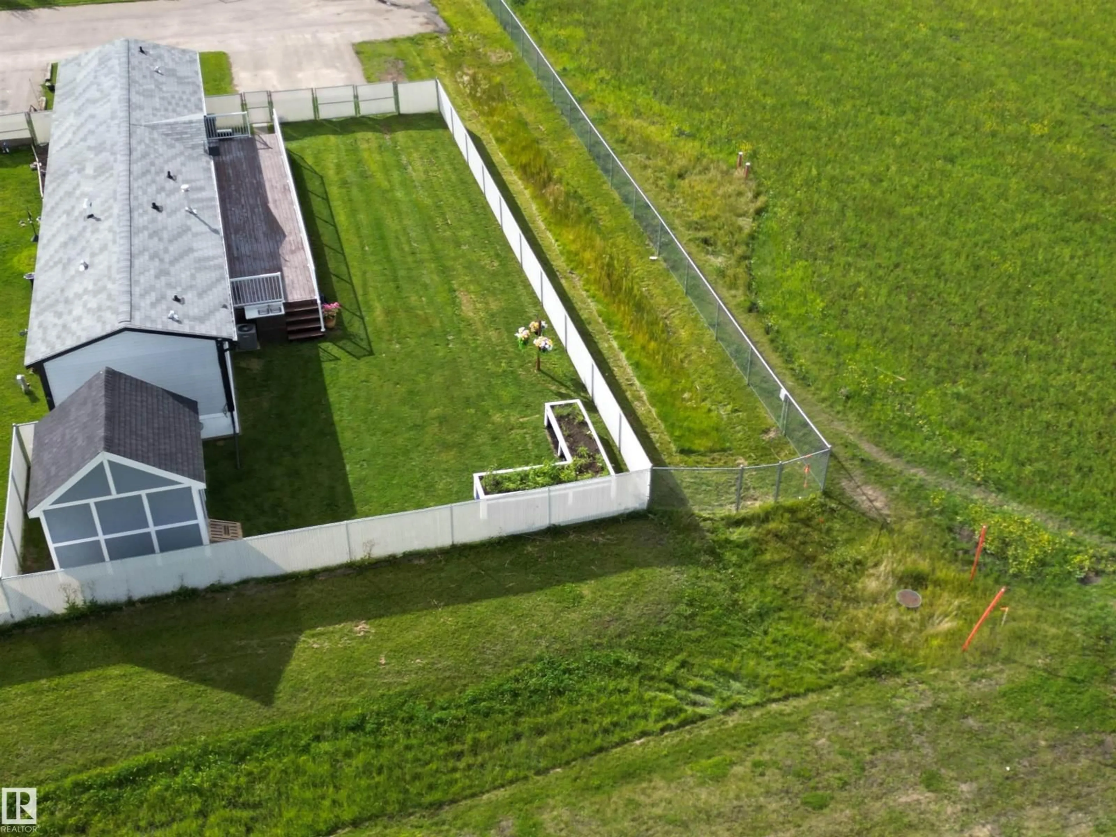A pic from outside/outdoor area/front of a property/back of a property/a pic from drone, unknown for 41- - 5220 44 AV, Calmar Alberta T0C0V0