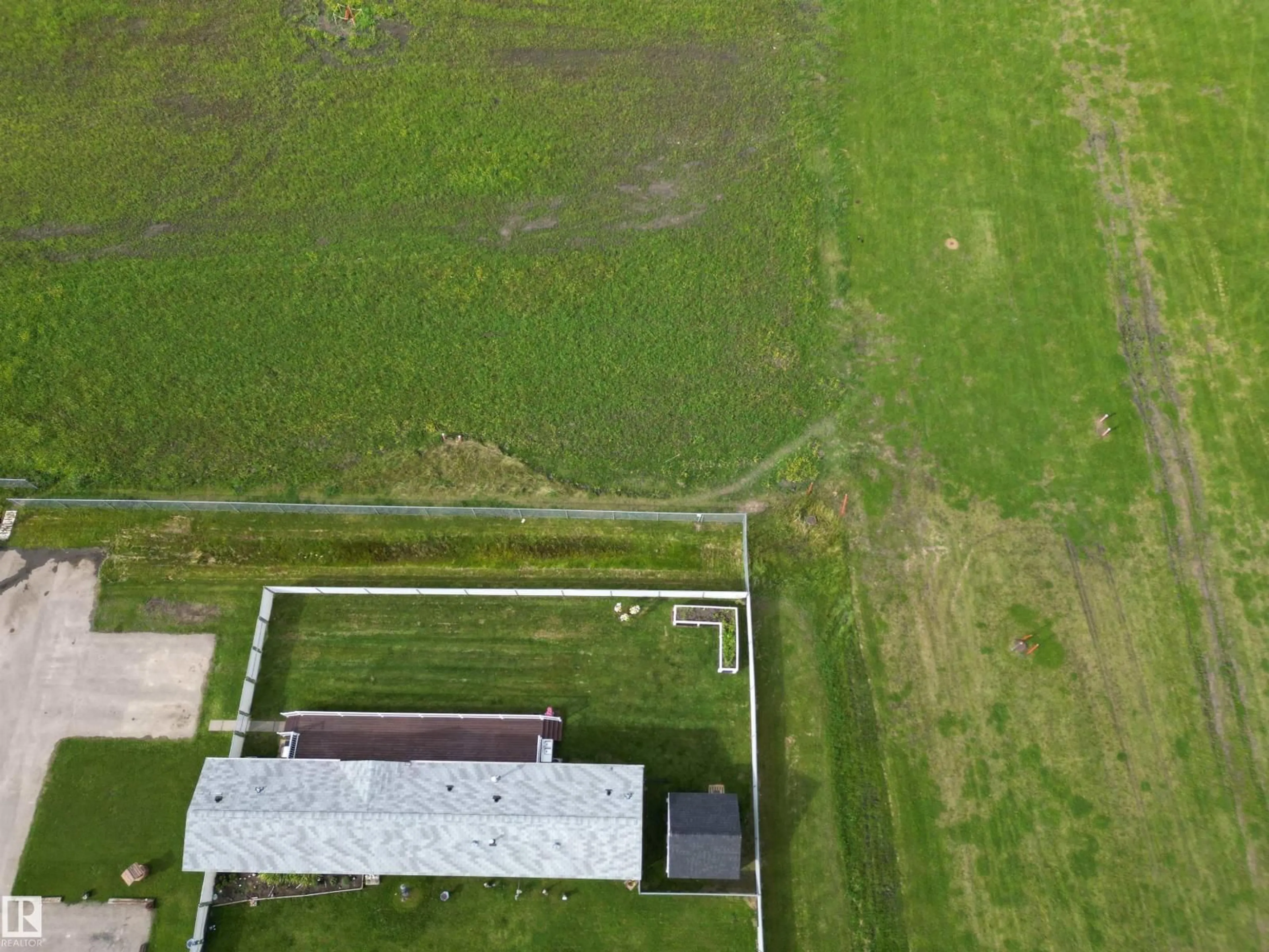 A pic from outside/outdoor area/front of a property/back of a property/a pic from drone, building for 41- - 5220 44 AV, Calmar Alberta T0C0V0