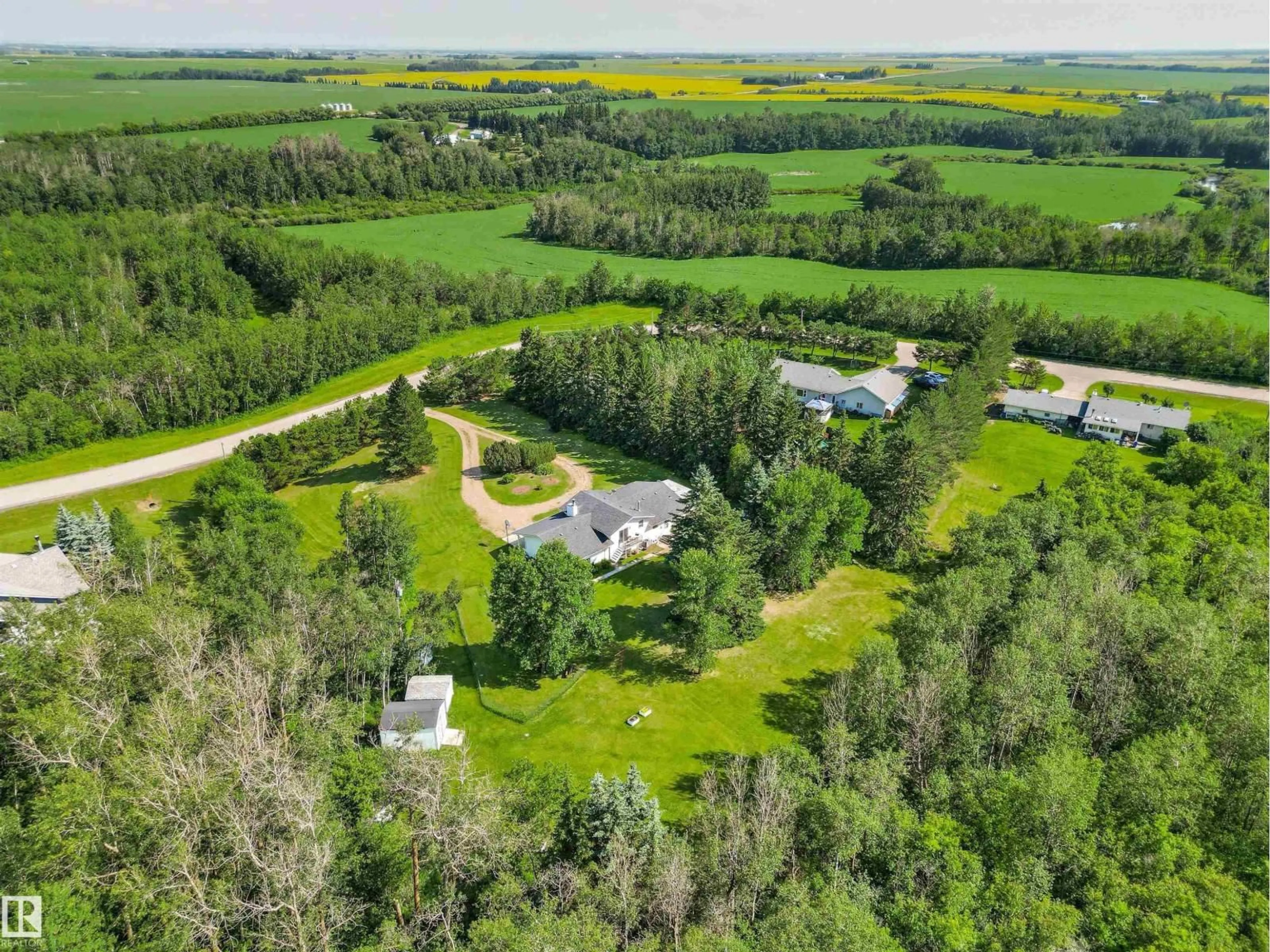 A pic from outside/outdoor area/front of a property/back of a property/a pic from drone, forest/trees view for 35 55312 RGE ROAD 241, Rural Sturgeon County Alberta T8T1X6