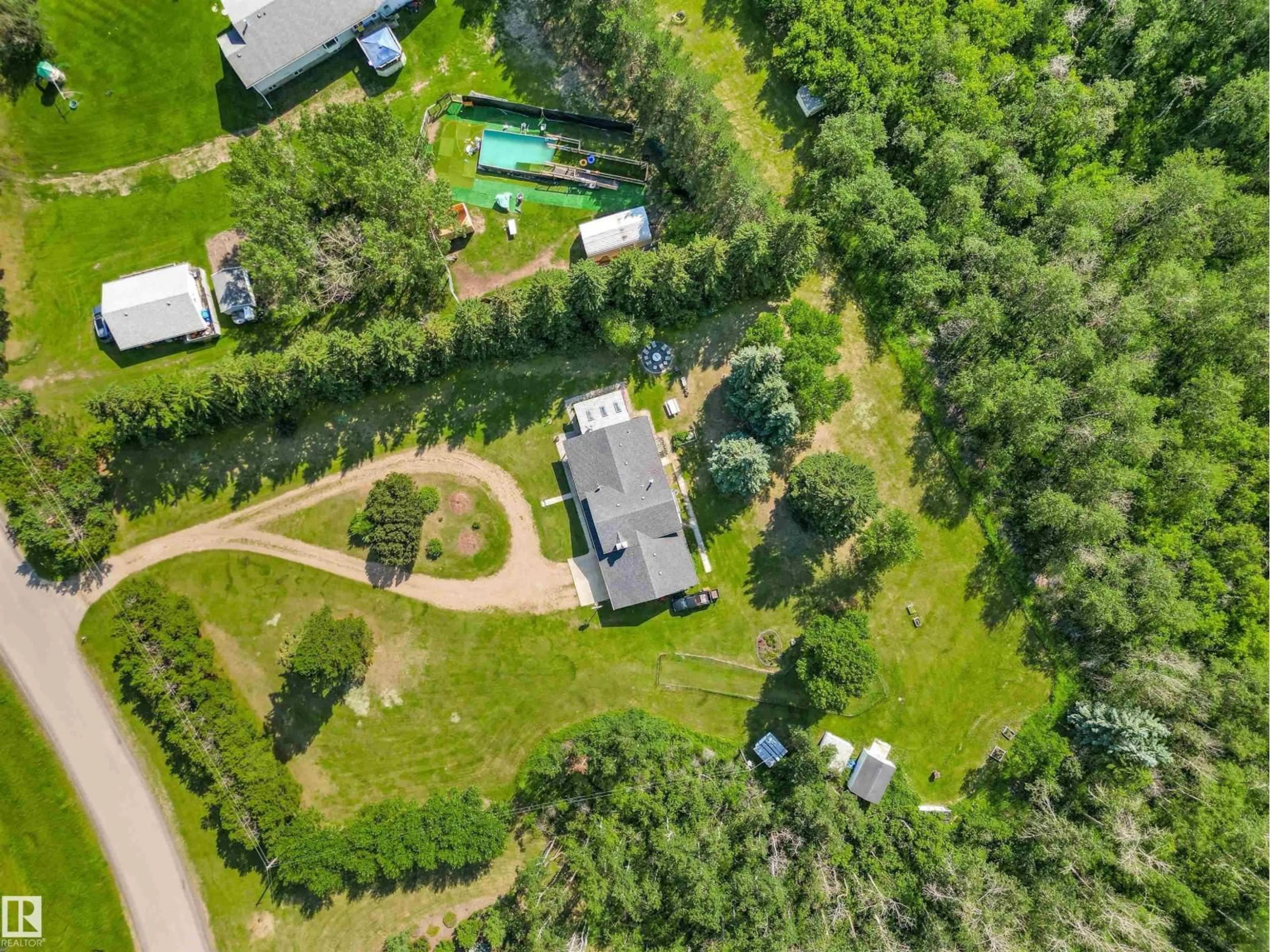 A pic from outside/outdoor area/front of a property/back of a property/a pic from drone, forest/trees view for 35 55312 RGE ROAD 241, Rural Sturgeon County Alberta T8T1X6