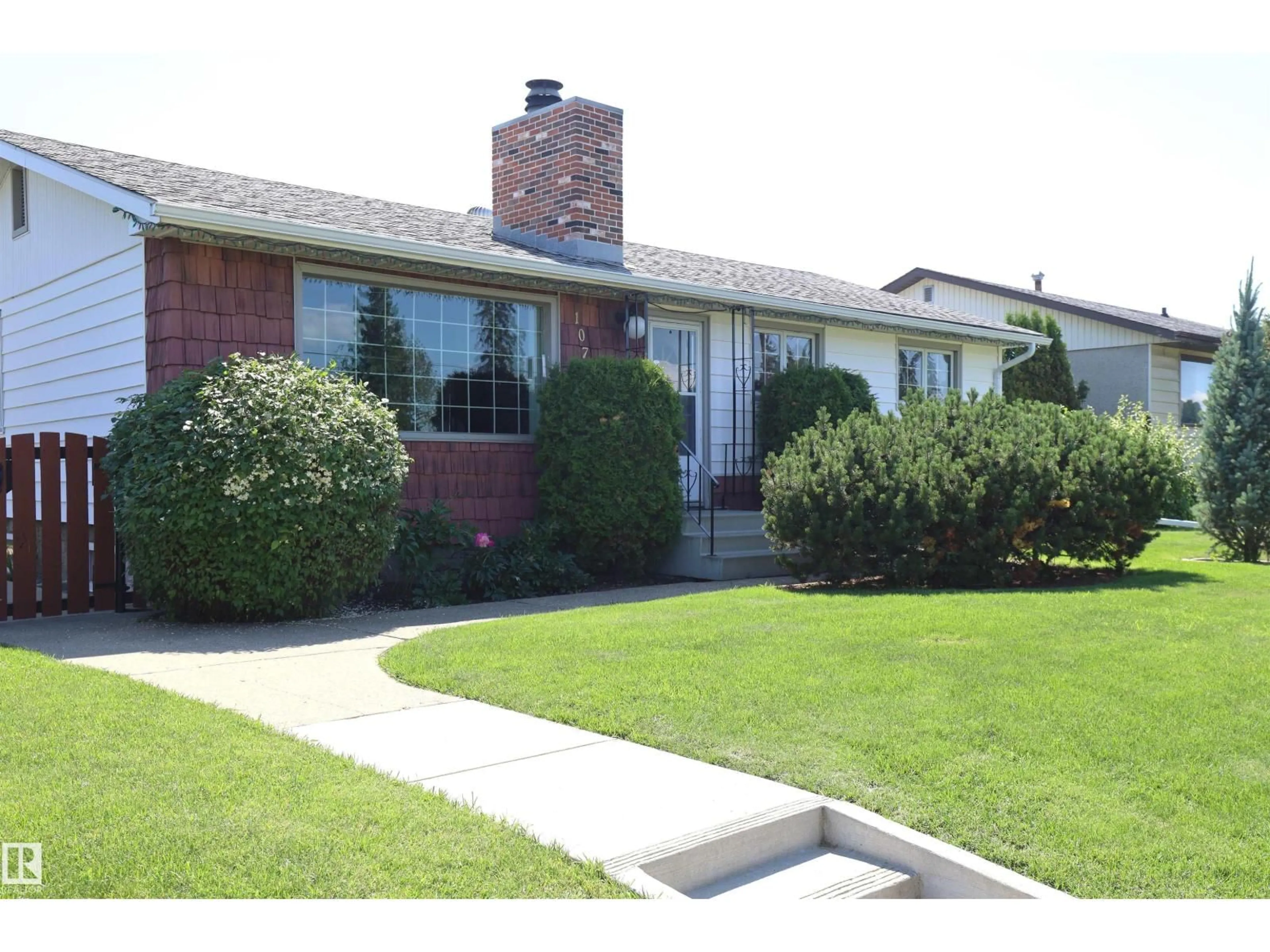 Home with brick exterior material, street for 10715 132 AV, Edmonton Alberta T5E0Z5