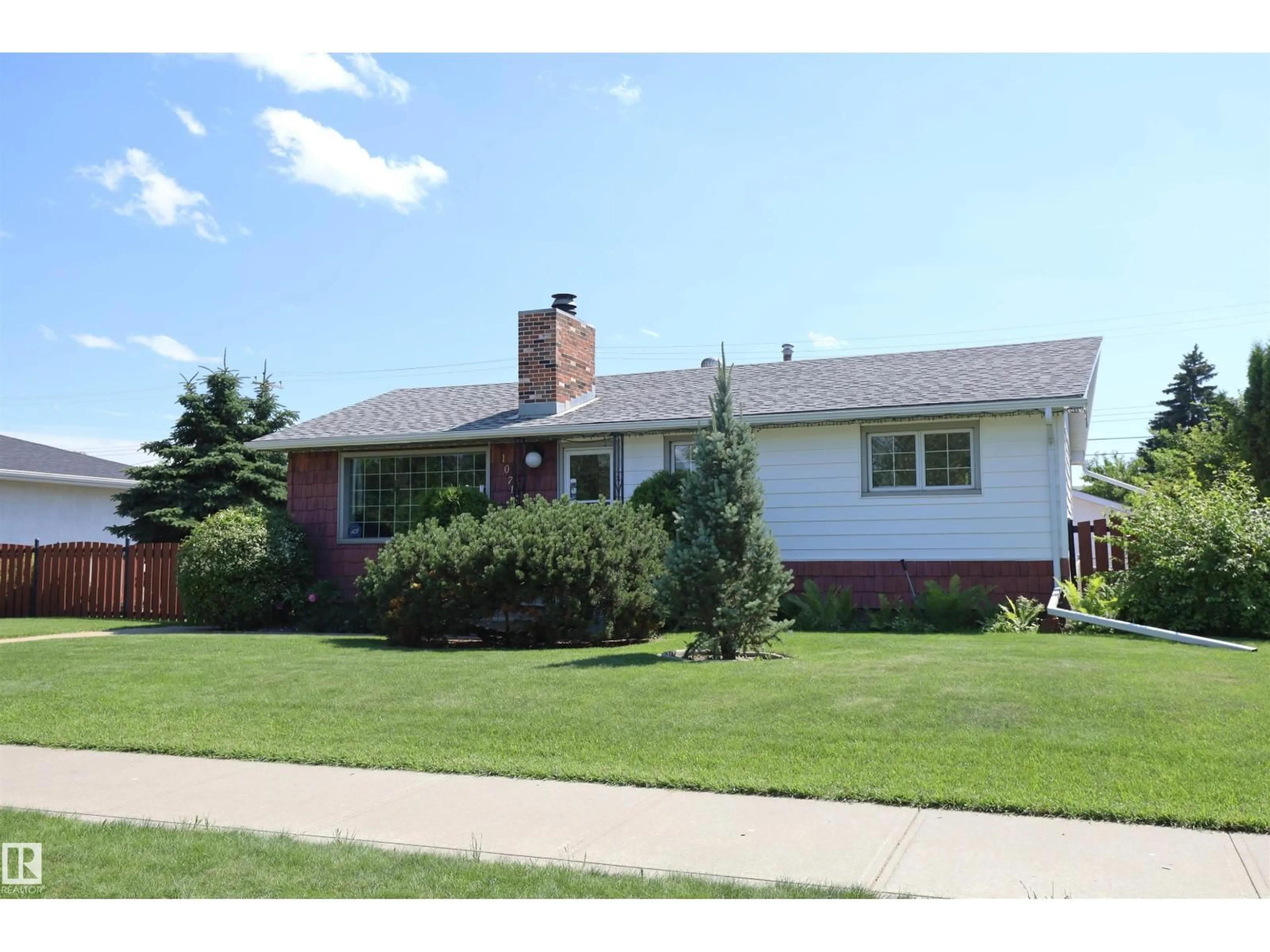 Home with brick exterior material, street for 10715 132 AV, Edmonton Alberta T5E0Z5