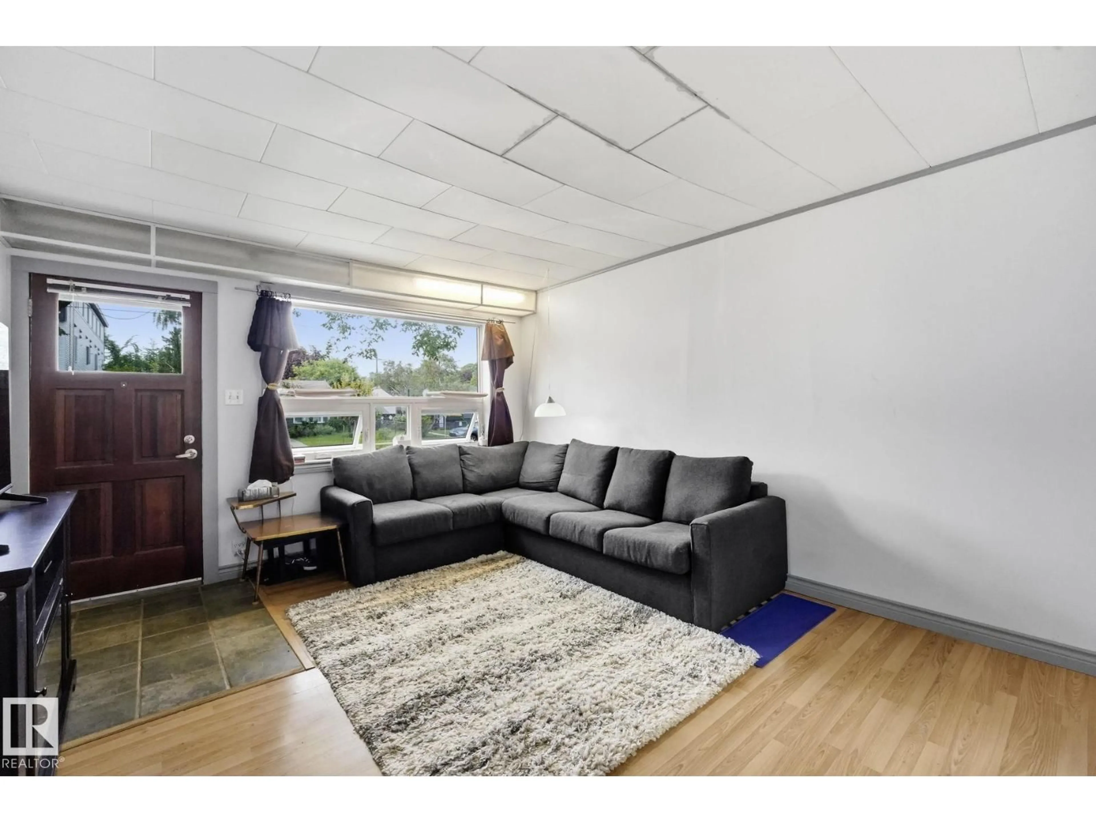Living room with furniture, unknown for 11525 129 AV, Edmonton Alberta T5E0M4