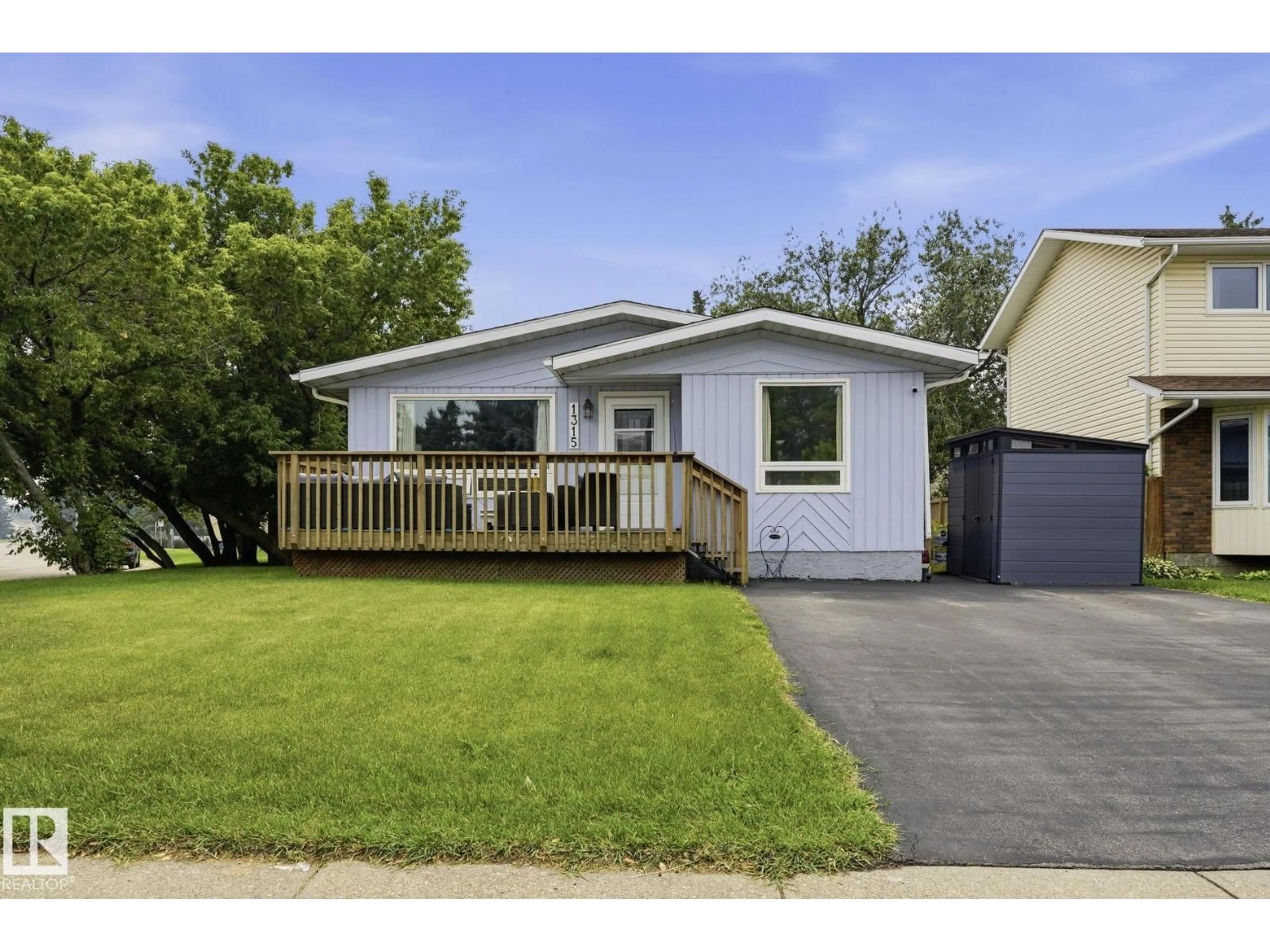Home with vinyl exterior material, street for 1315 KNOTTWOOD RD, Edmonton Alberta T6K2K5