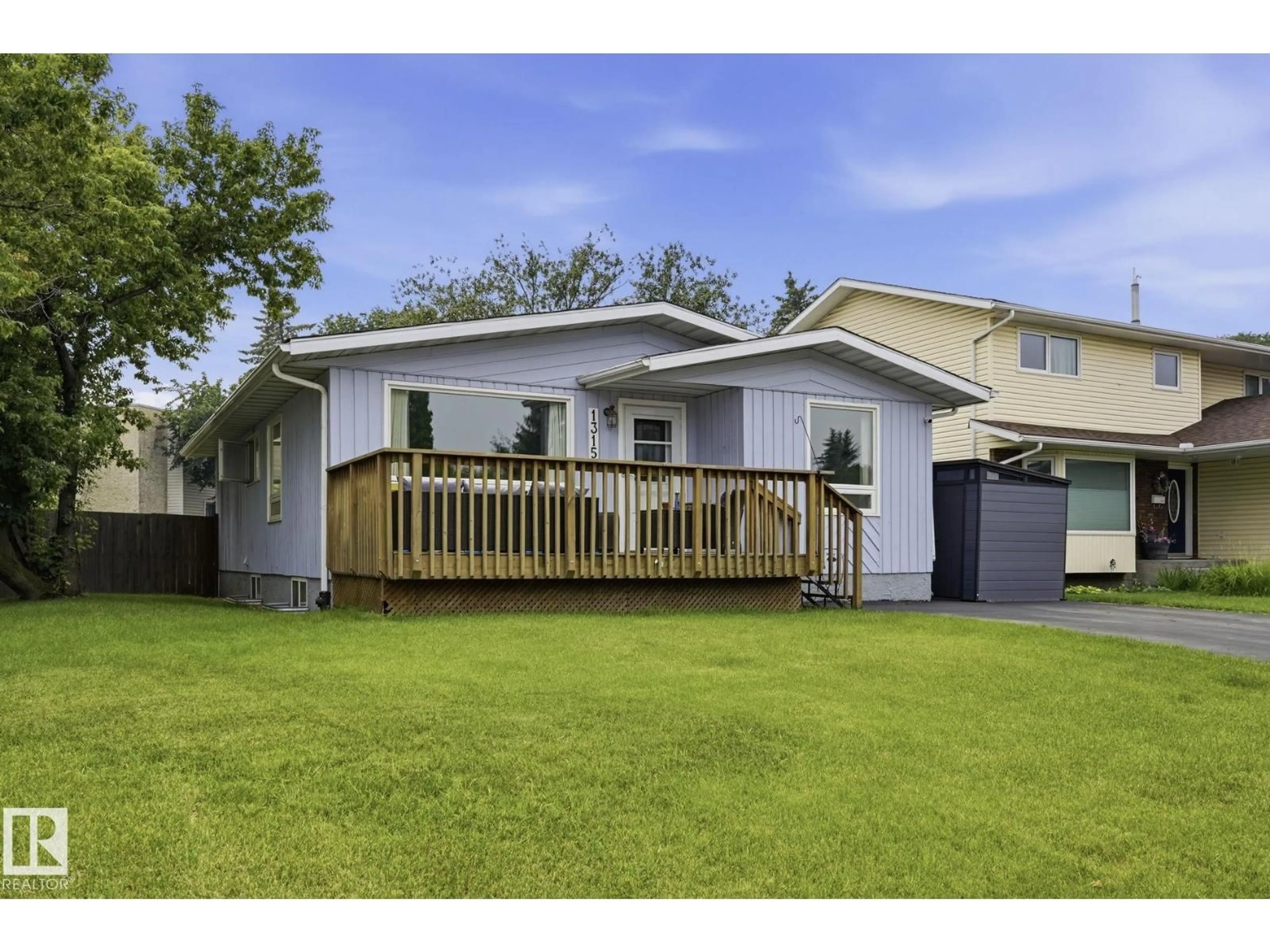 Home with vinyl exterior material, street for 1315 KNOTTWOOD RD, Edmonton Alberta T6K2K5