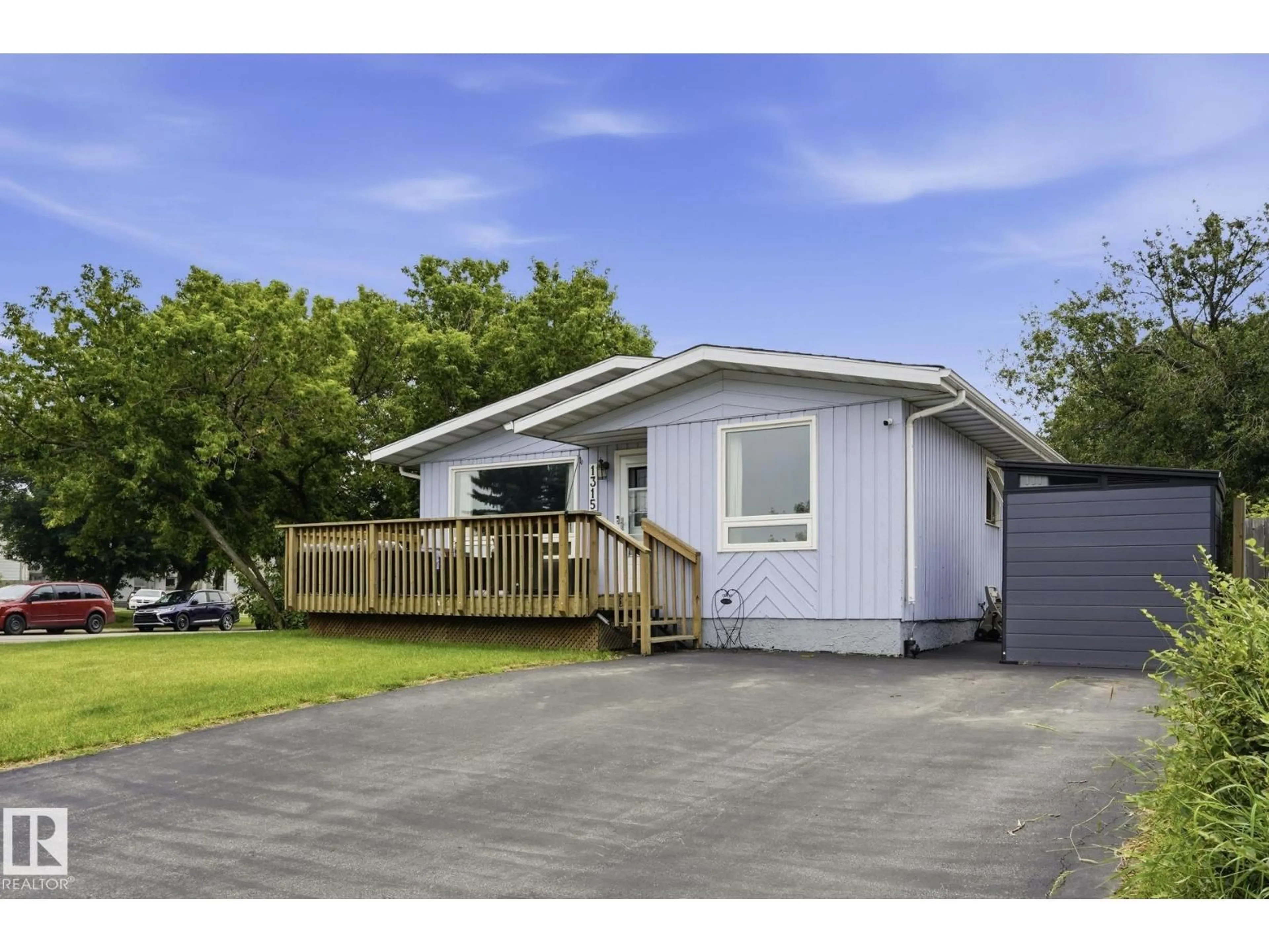 Home with vinyl exterior material, street for 1315 KNOTTWOOD RD, Edmonton Alberta T6K2K5