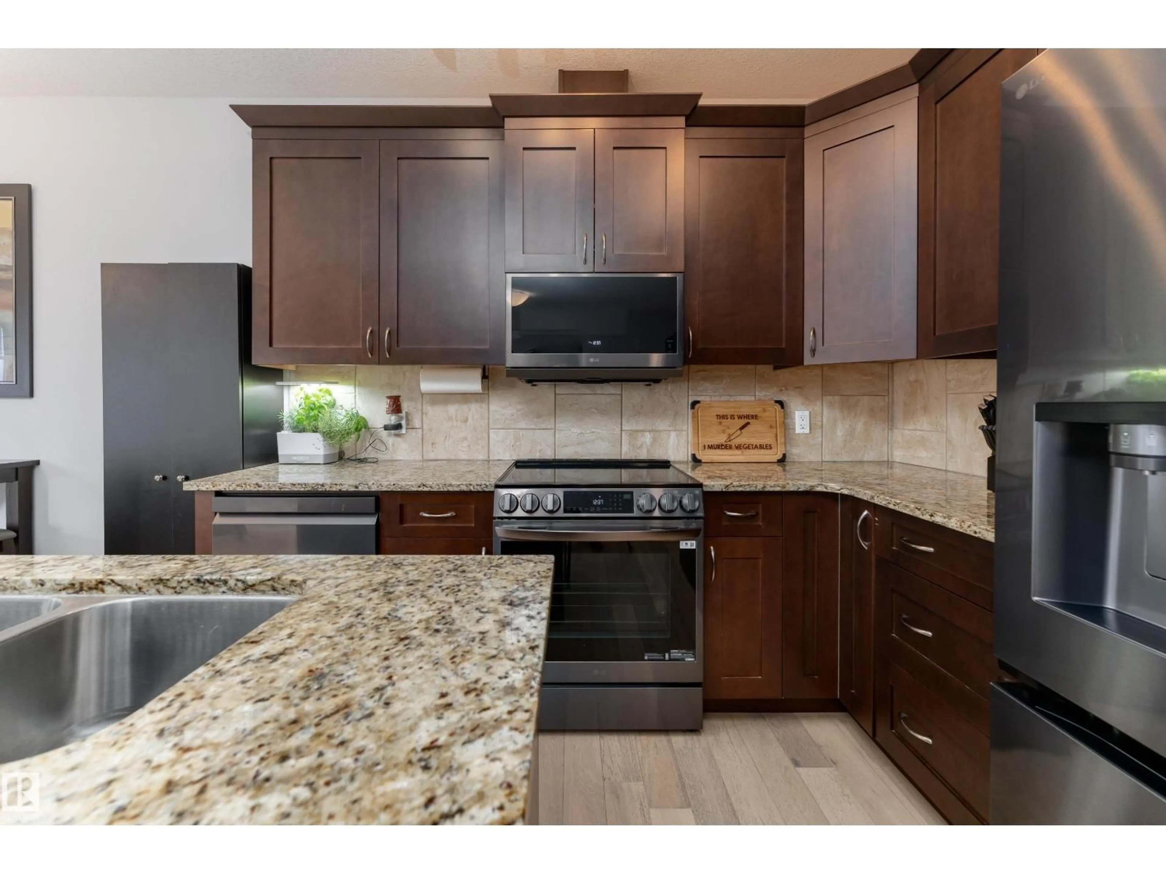 Open concept kitchen, ceramic/tile floor for 16805 55 ST, Edmonton Alberta T5Y0R3