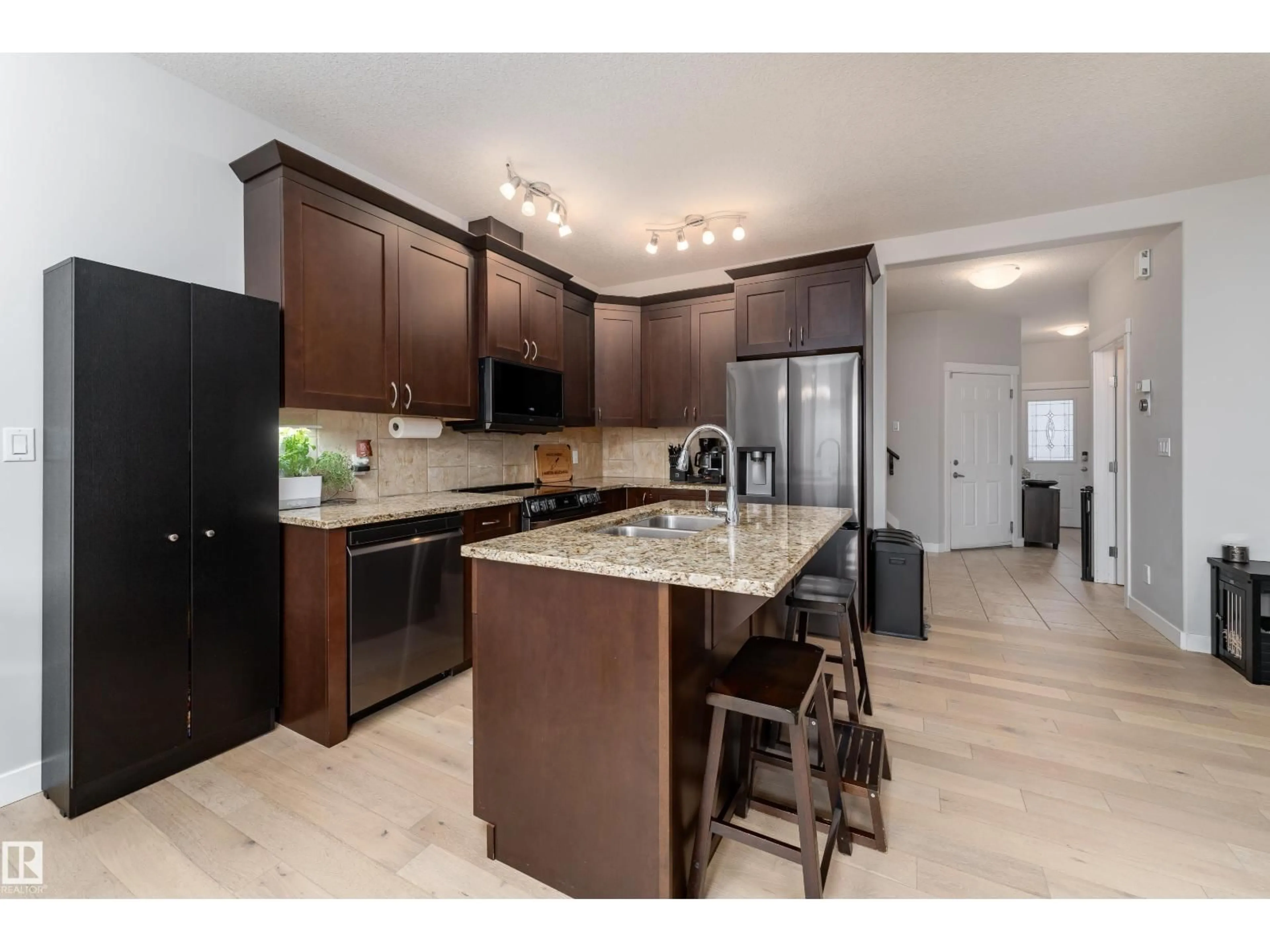 Open concept kitchen, ceramic/tile floor for 16805 55 ST, Edmonton Alberta T5Y0R3