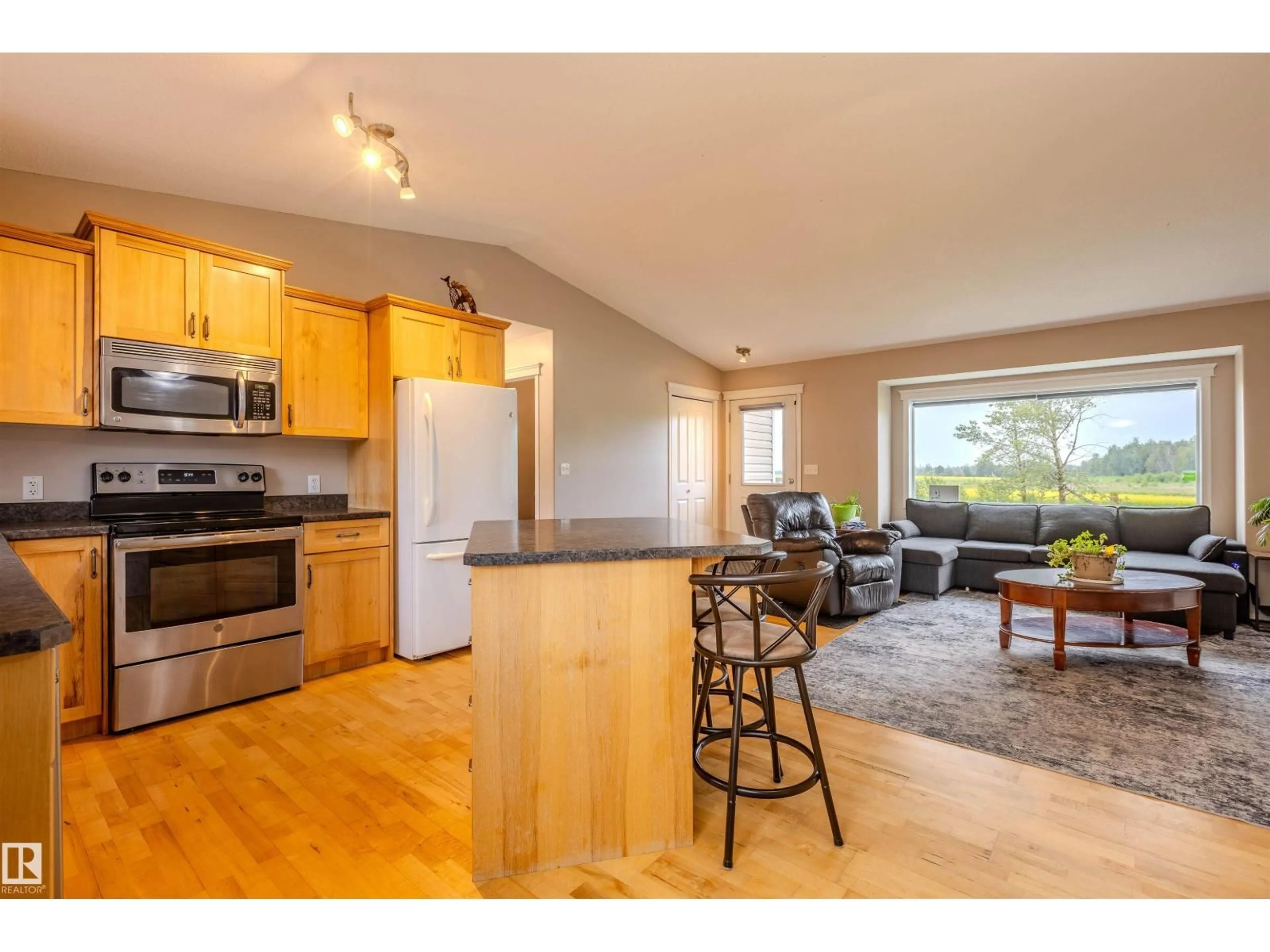 Open concept kitchen, wood/laminate floor for 4712 50 AV, Pickardville Alberta T0G1W0