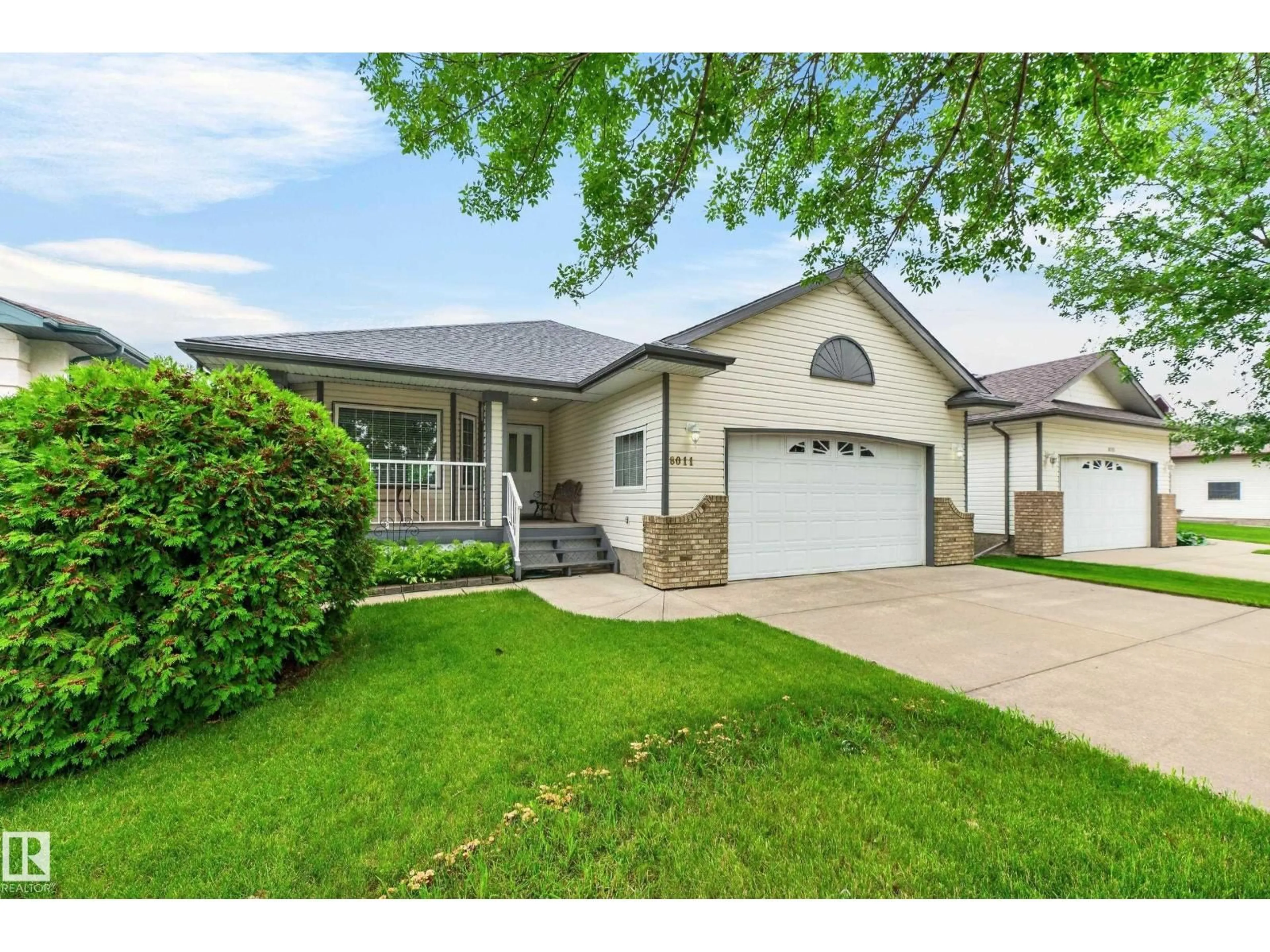 Home with vinyl exterior material, street for 8011 164 AV, Edmonton Alberta T5Z3J3