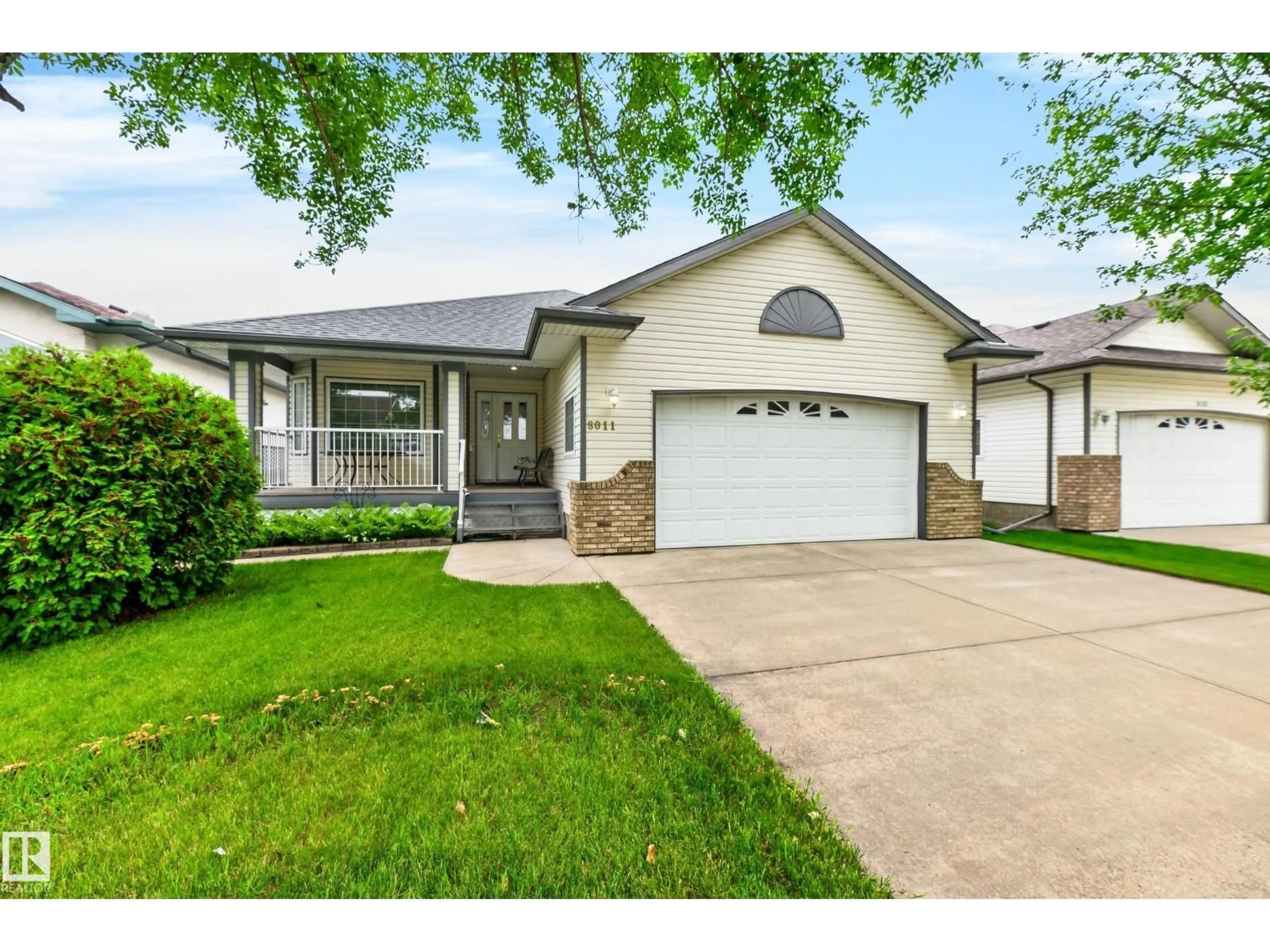 Home with vinyl exterior material, street for 8011 164 AV, Edmonton Alberta T5Z3J3