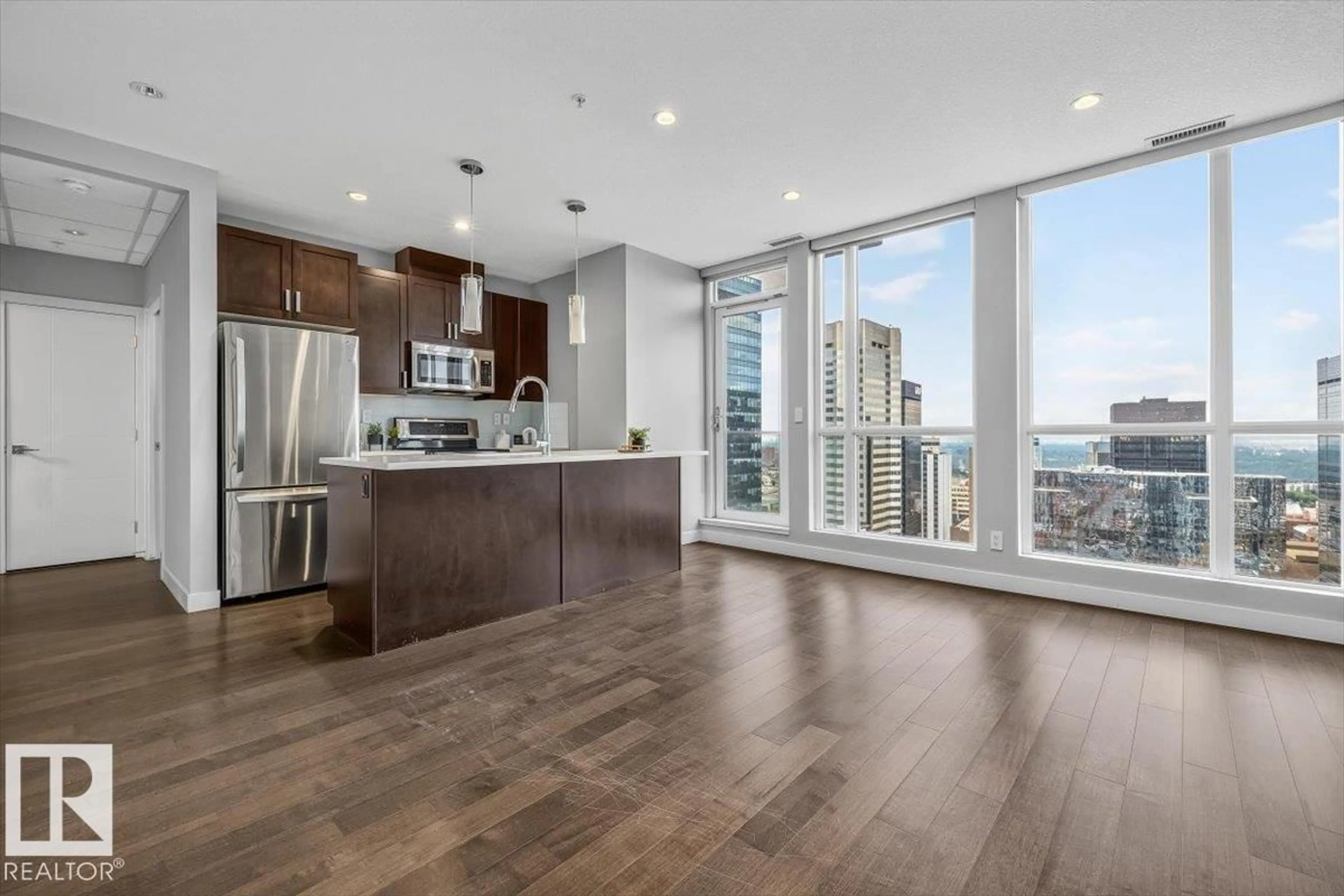 Open concept kitchen, wood/laminate floor for 10238 - 2702 103 ST, Edmonton Alberta T5J0G6