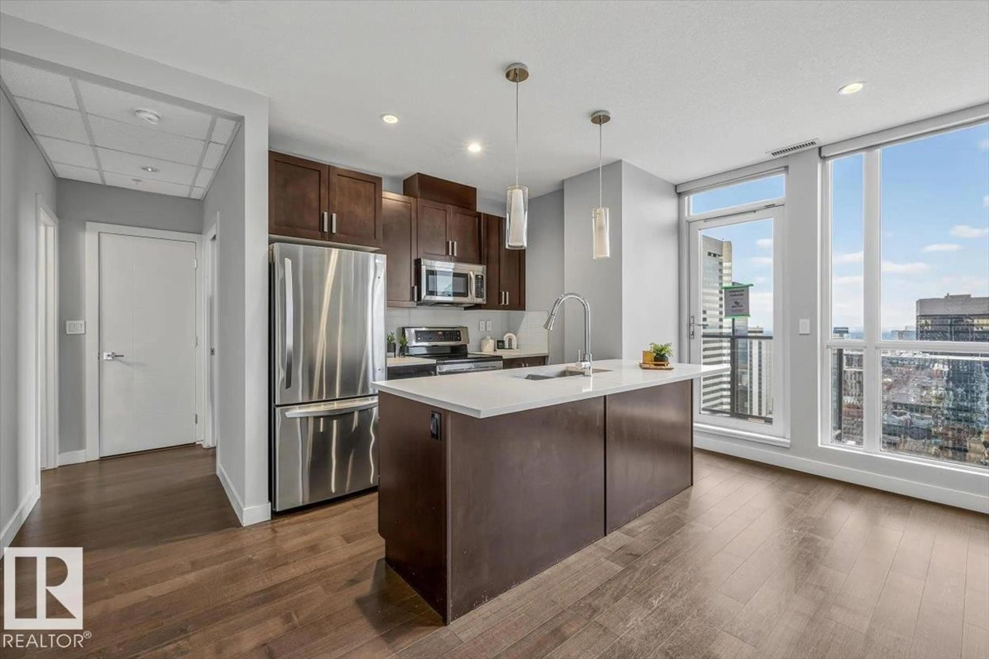 Open concept kitchen, wood/laminate floor for 10238 - 2702 103 ST, Edmonton Alberta T5J0G6