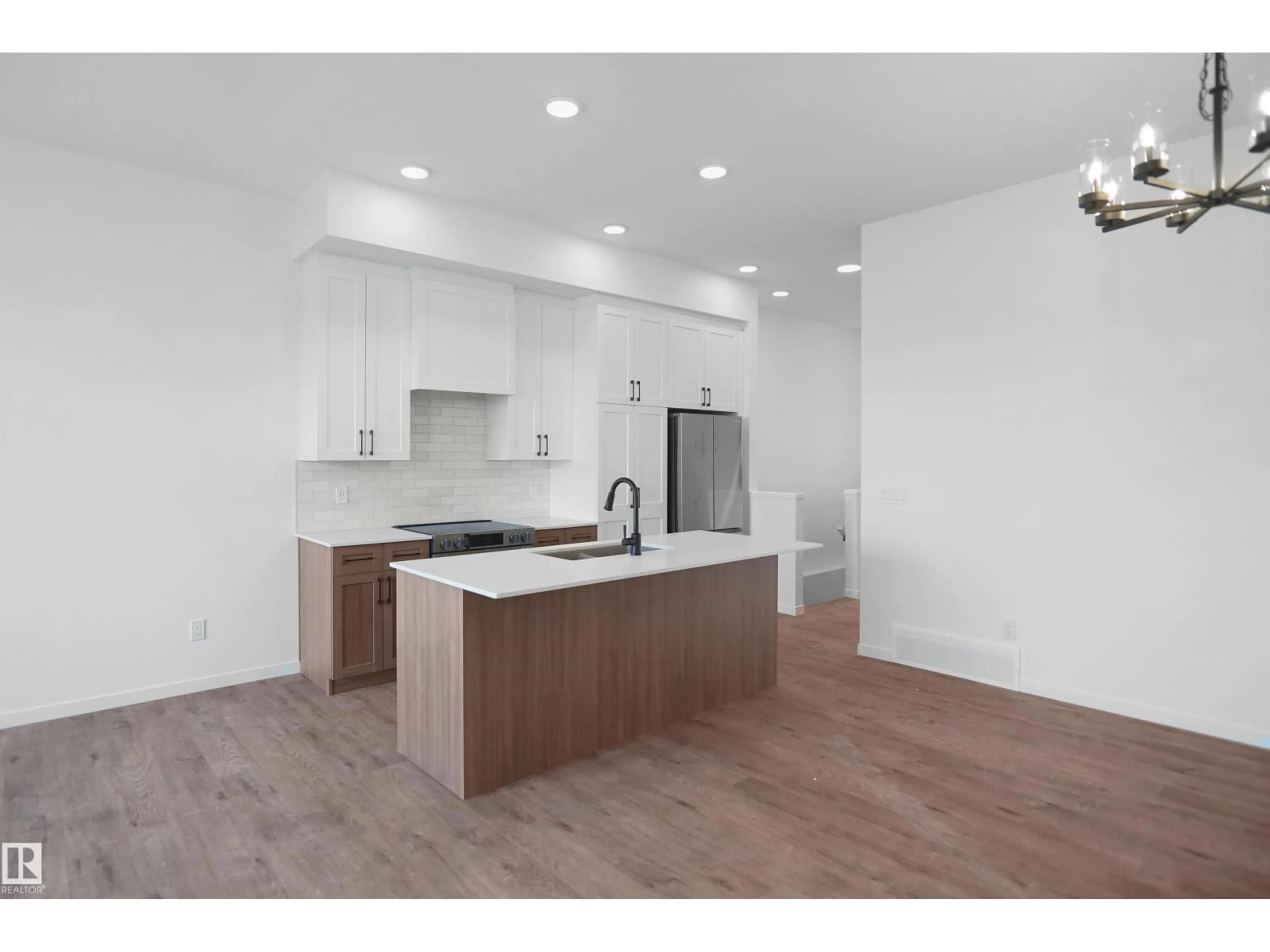 Open concept kitchen, wood/laminate floor for 7523 OBSERVER LN, Edmonton Alberta T5G2S5