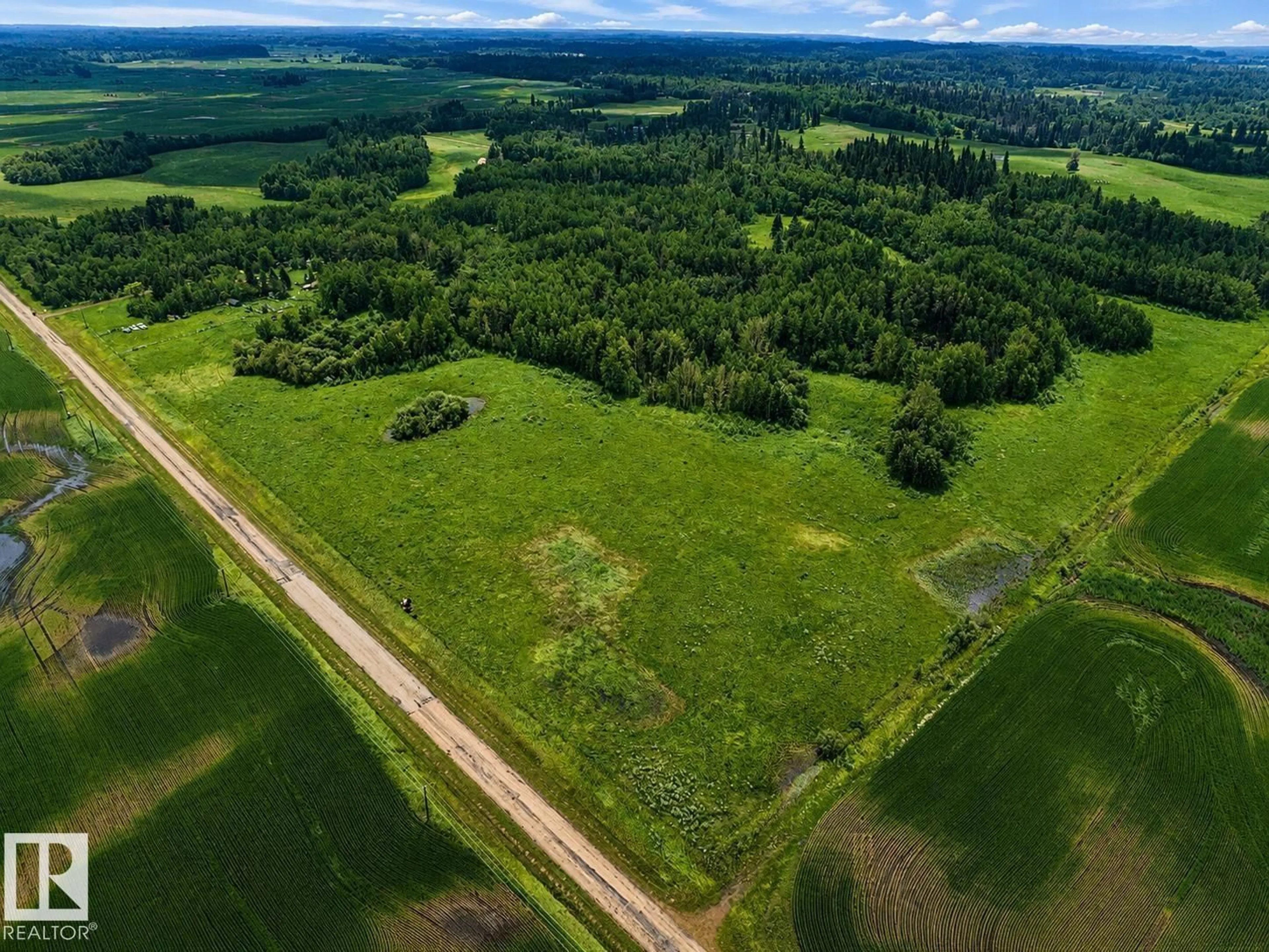 A pic from outside/outdoor area/front of a property/back of a property/a pic from drone, forest/trees view for 20519 TWP ROAD 550, Rural Strathcona County Alberta T8L4B6