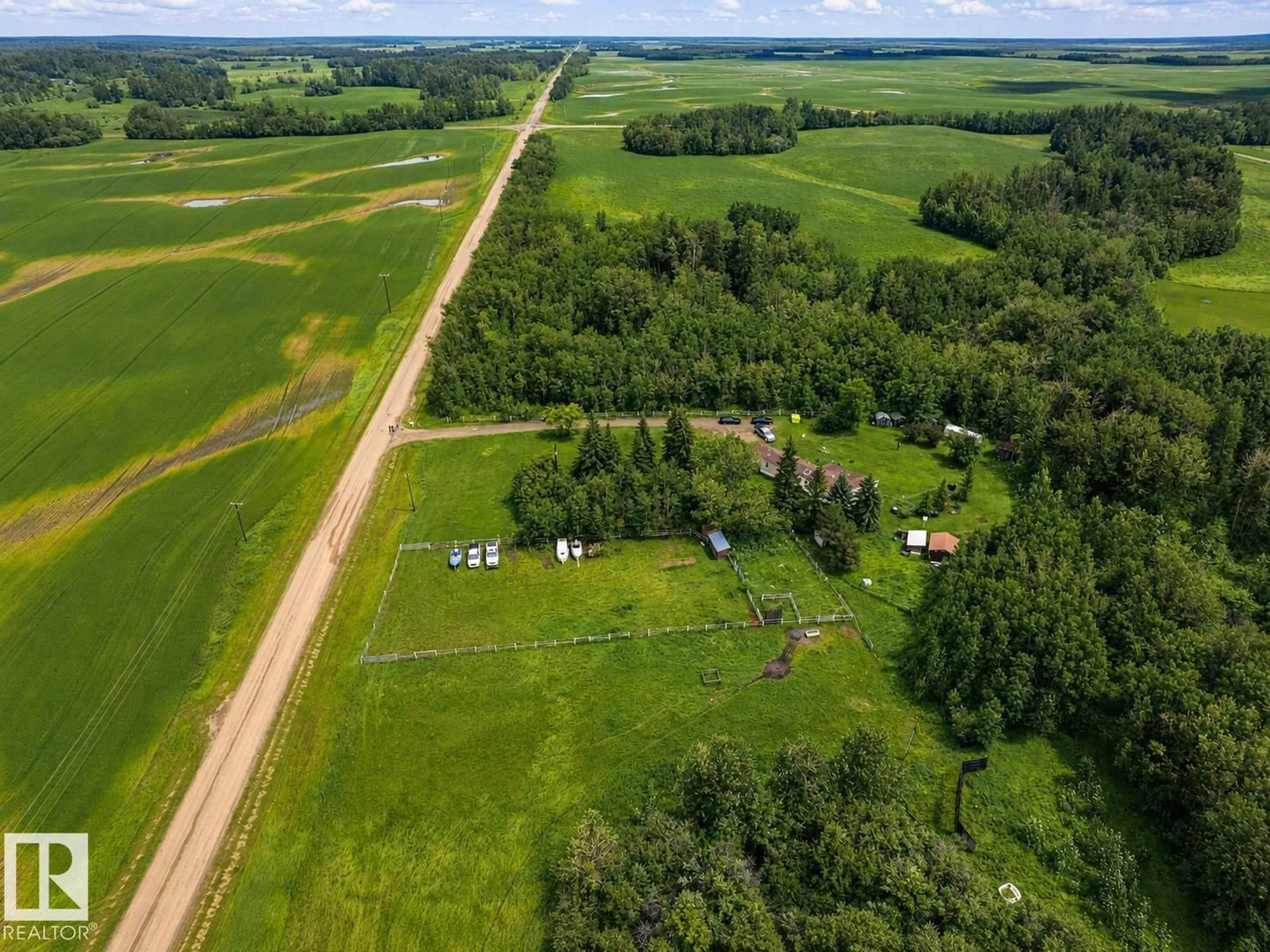 A pic from outside/outdoor area/front of a property/back of a property/a pic from drone, unknown for 20519 TWP ROAD 550, Rural Strathcona County Alberta T8L4B6