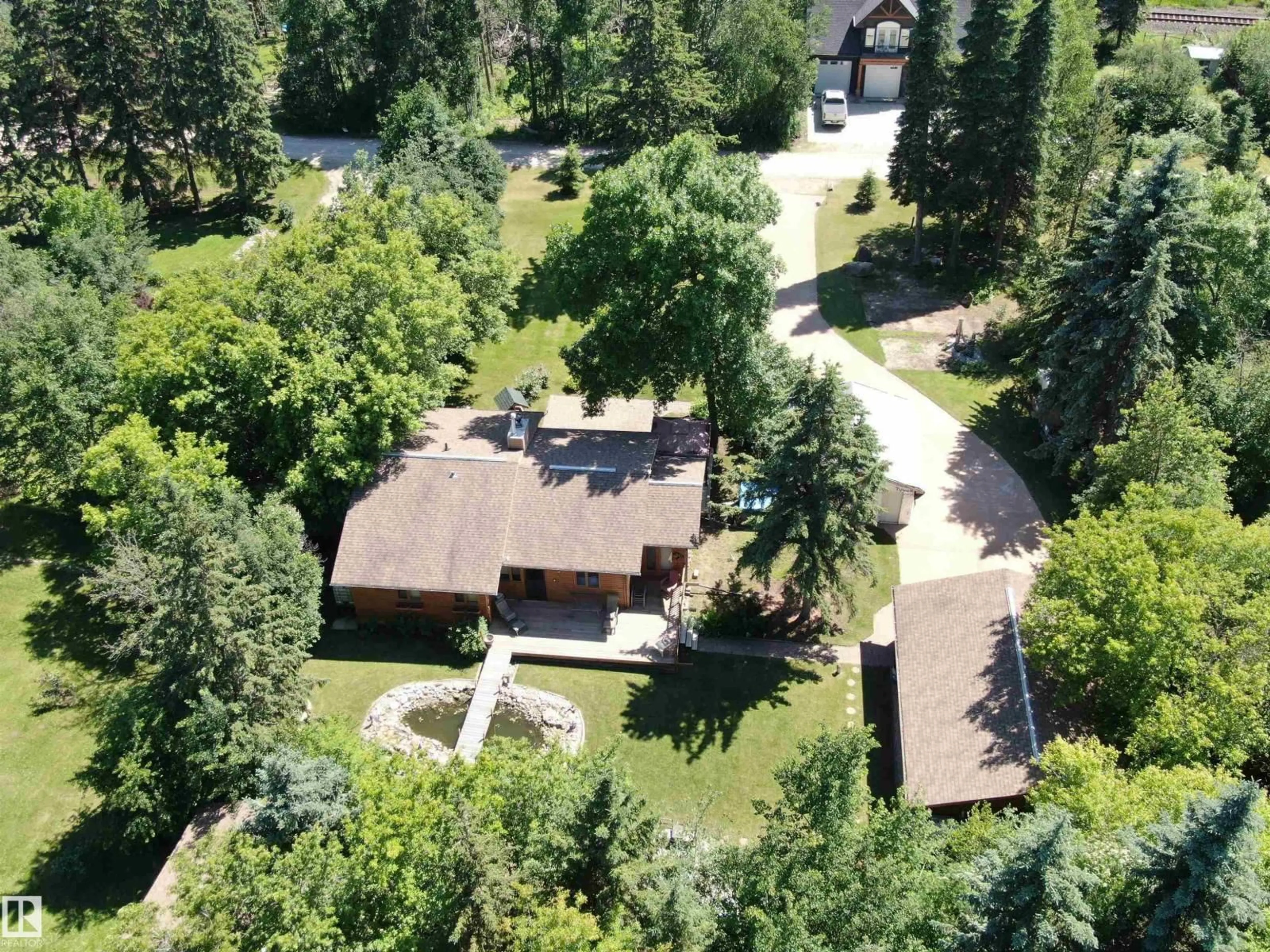 A pic from outside/outdoor area/front of a property/back of a property/a pic from drone, unknown for 4521 - 128 LAKESHORE RD, Rural Parkland County Alberta T0E2K0