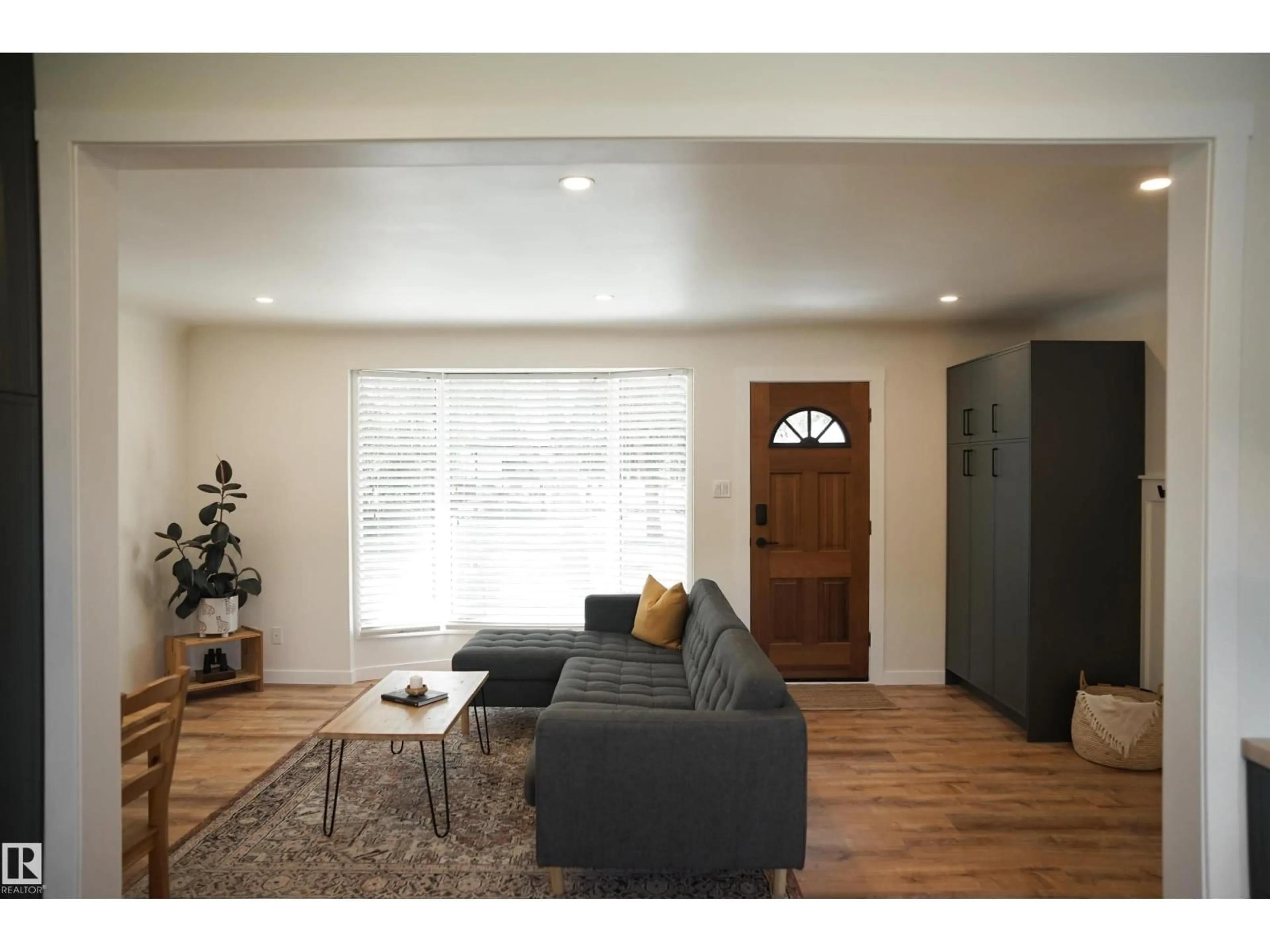 Living room with furniture, wood/laminate floor for 9909 108 ST, Fort Saskatchewan Alberta T8L2J3