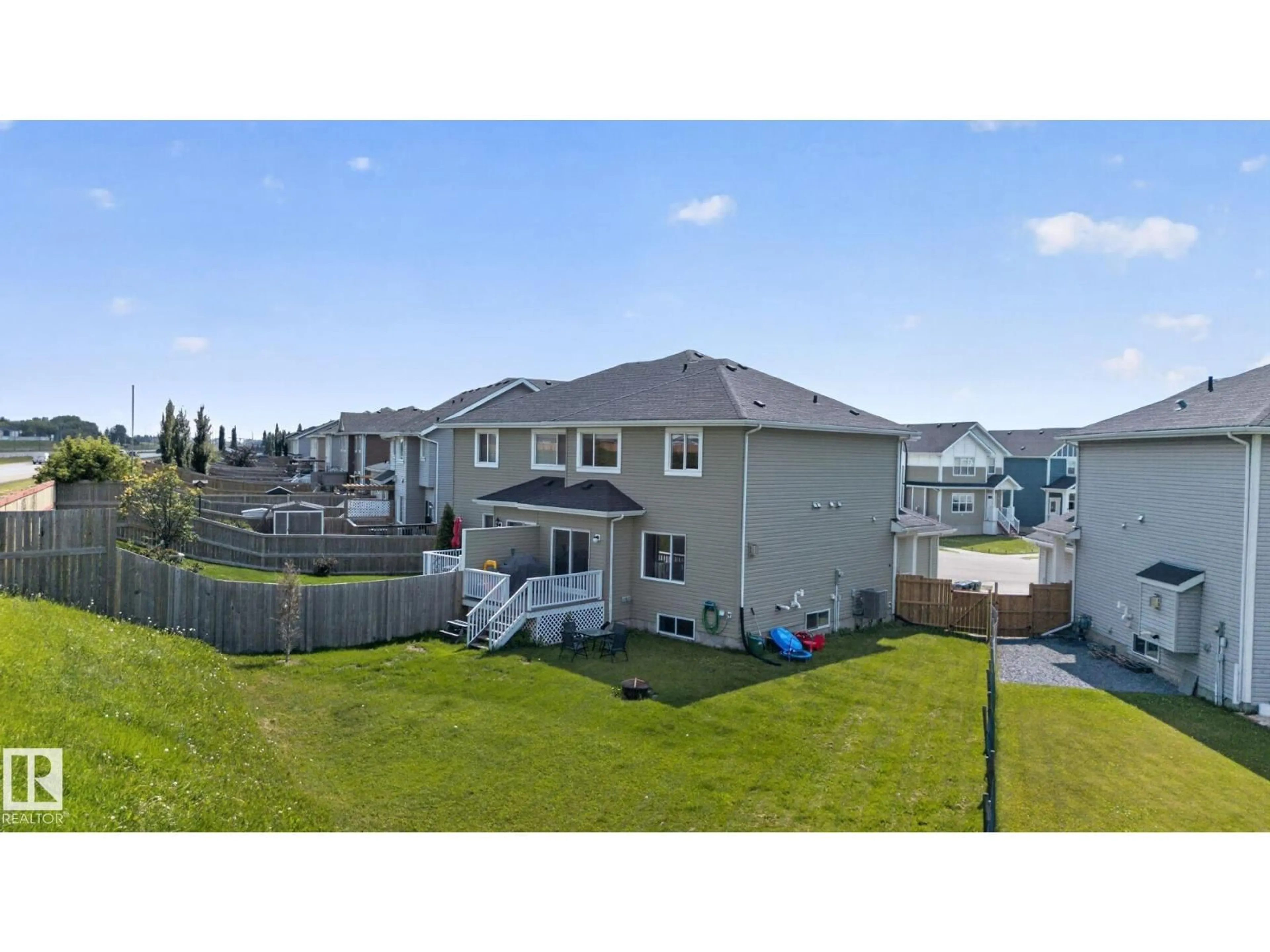 A pic from outside/outdoor area/front of a property/back of a property/a pic from drone, mountain view for 385 SIMMONDS WY, Leduc Alberta T9E0Y9