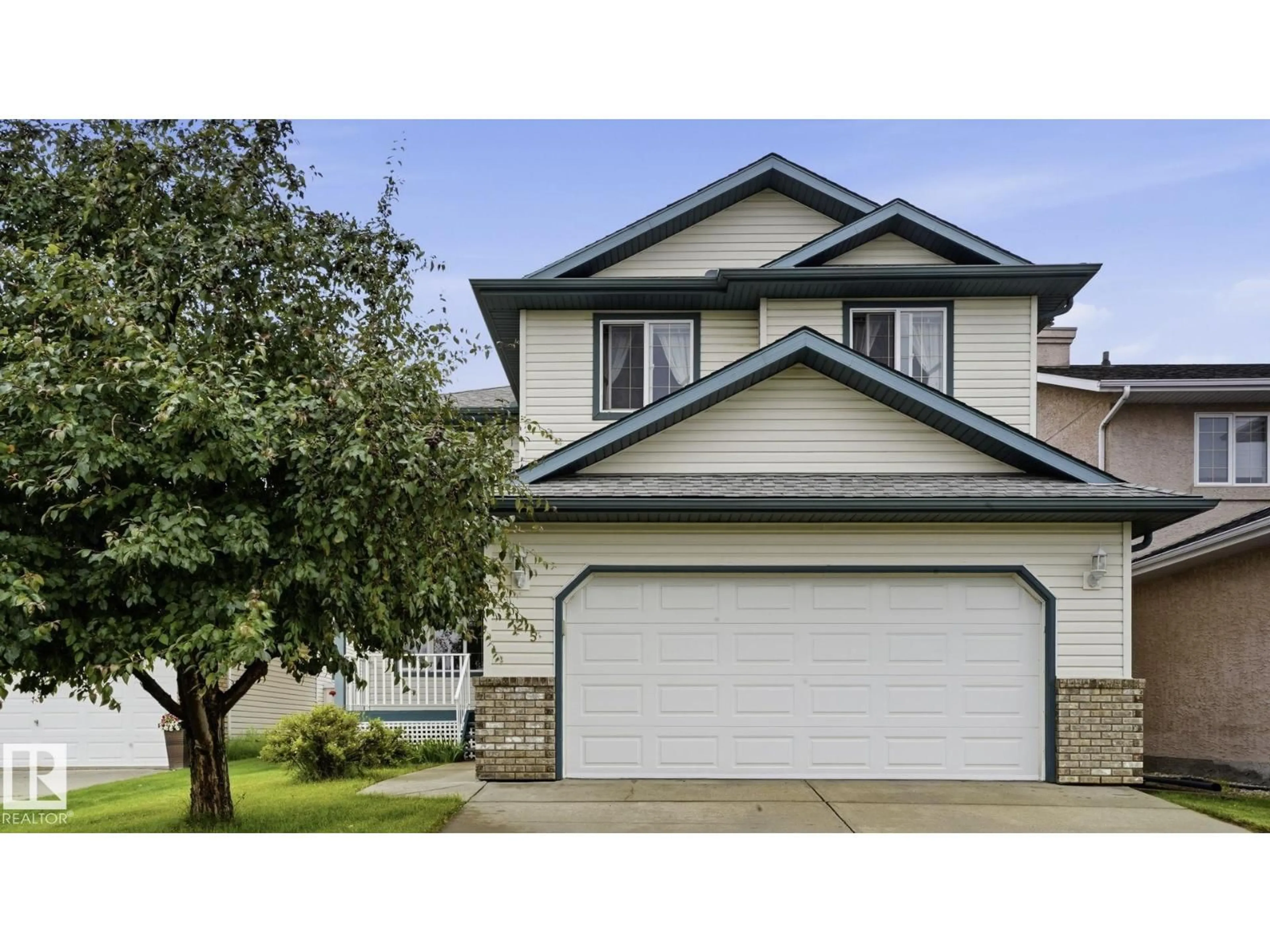 Home with vinyl exterior material, street for 125 DECHENE RD, Edmonton Alberta T6M2N1