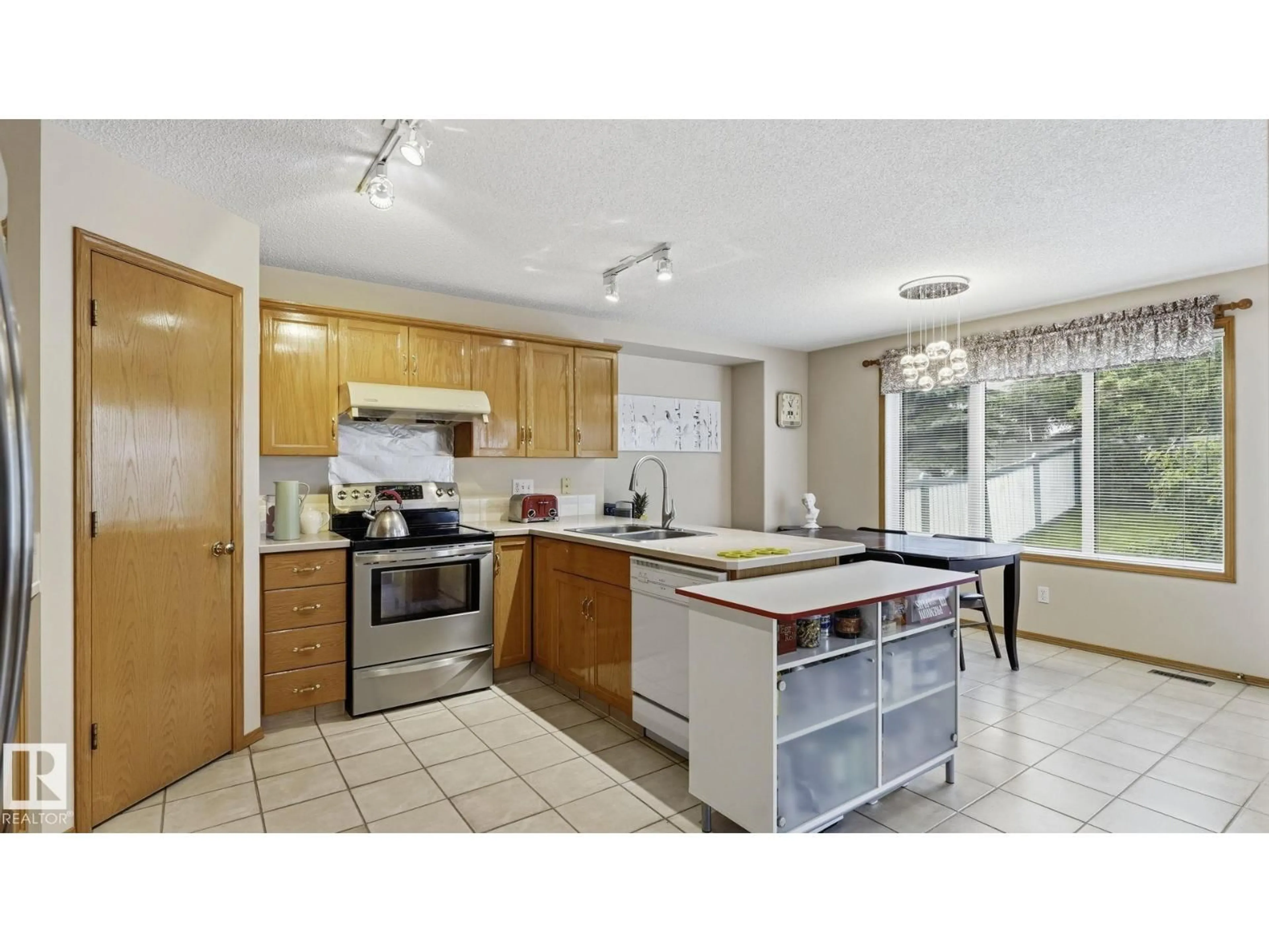Open concept kitchen, ceramic/tile floor for 125 DECHENE RD, Edmonton Alberta T6M2N1