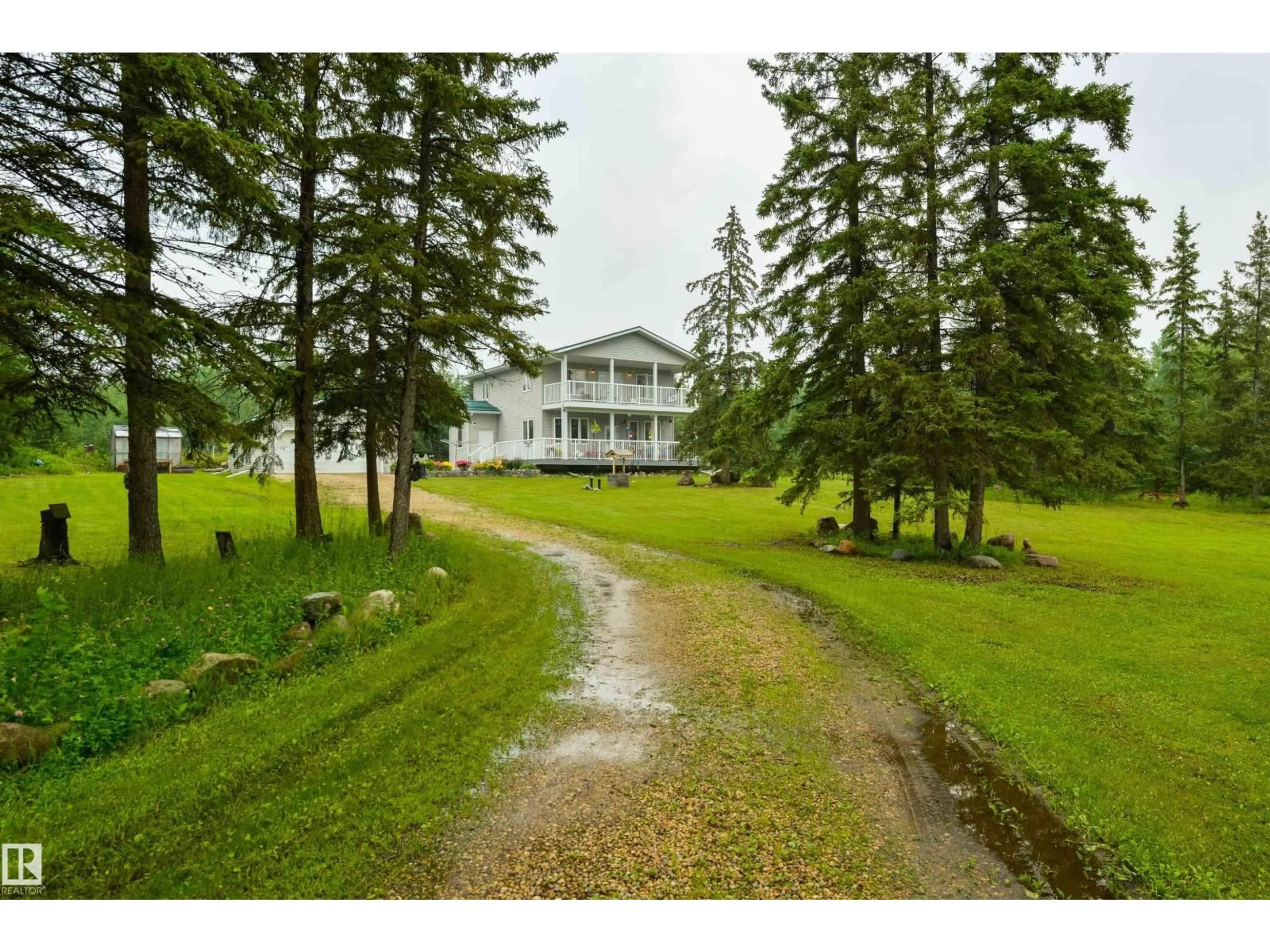 A pic from outside/outdoor area/front of a property/back of a property/a pic from drone, unknown for 56010 RGE ROAD 20A, Rural Lac Ste. Anne County Alberta T0E1V0