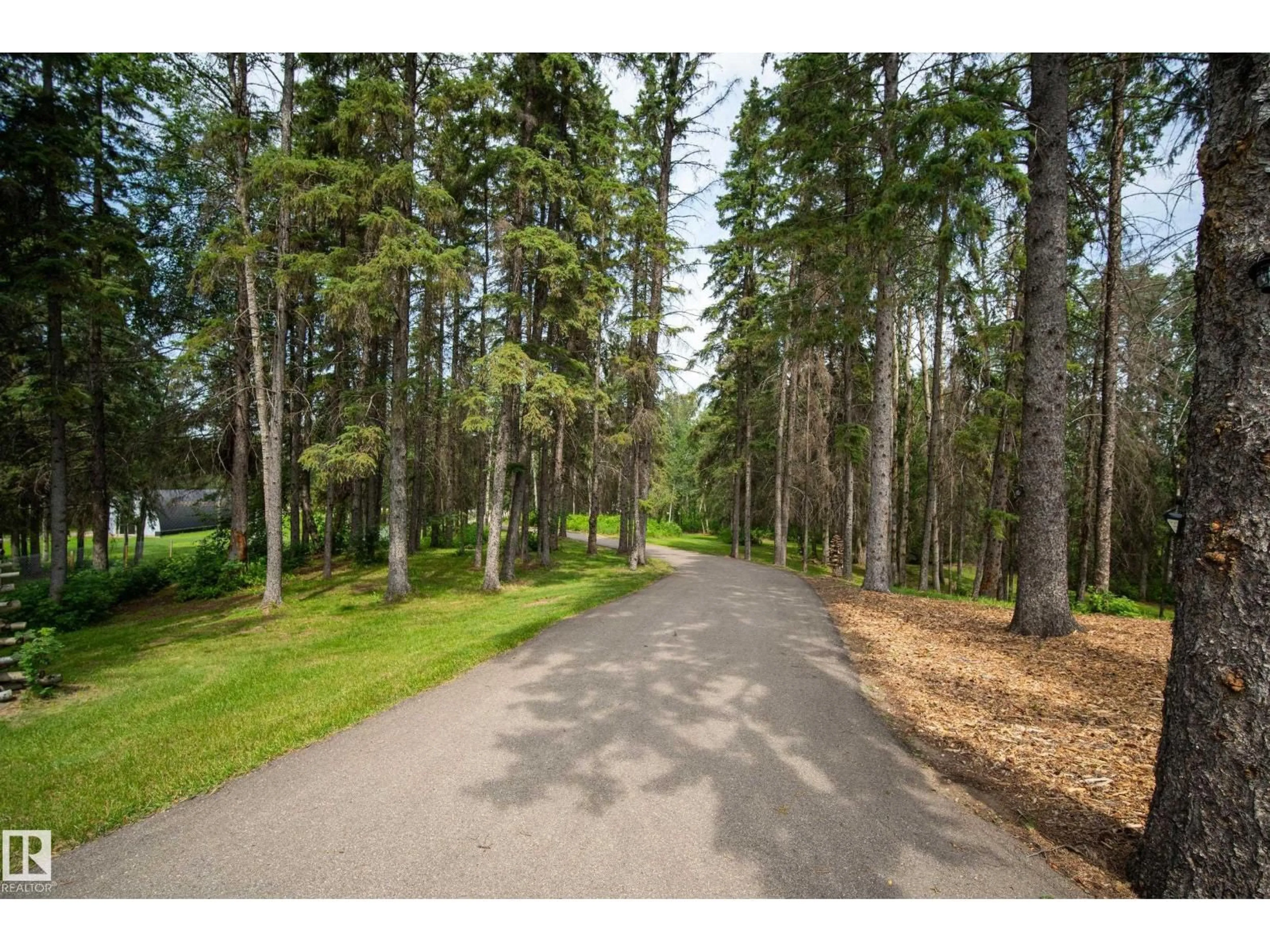 A pic from outside/outdoor area/front of a property/back of a property/a pic from drone, forest/trees view for 51511 - 16 RGE ROAD 264, Rural Parkland County Alberta T7Y1C7
