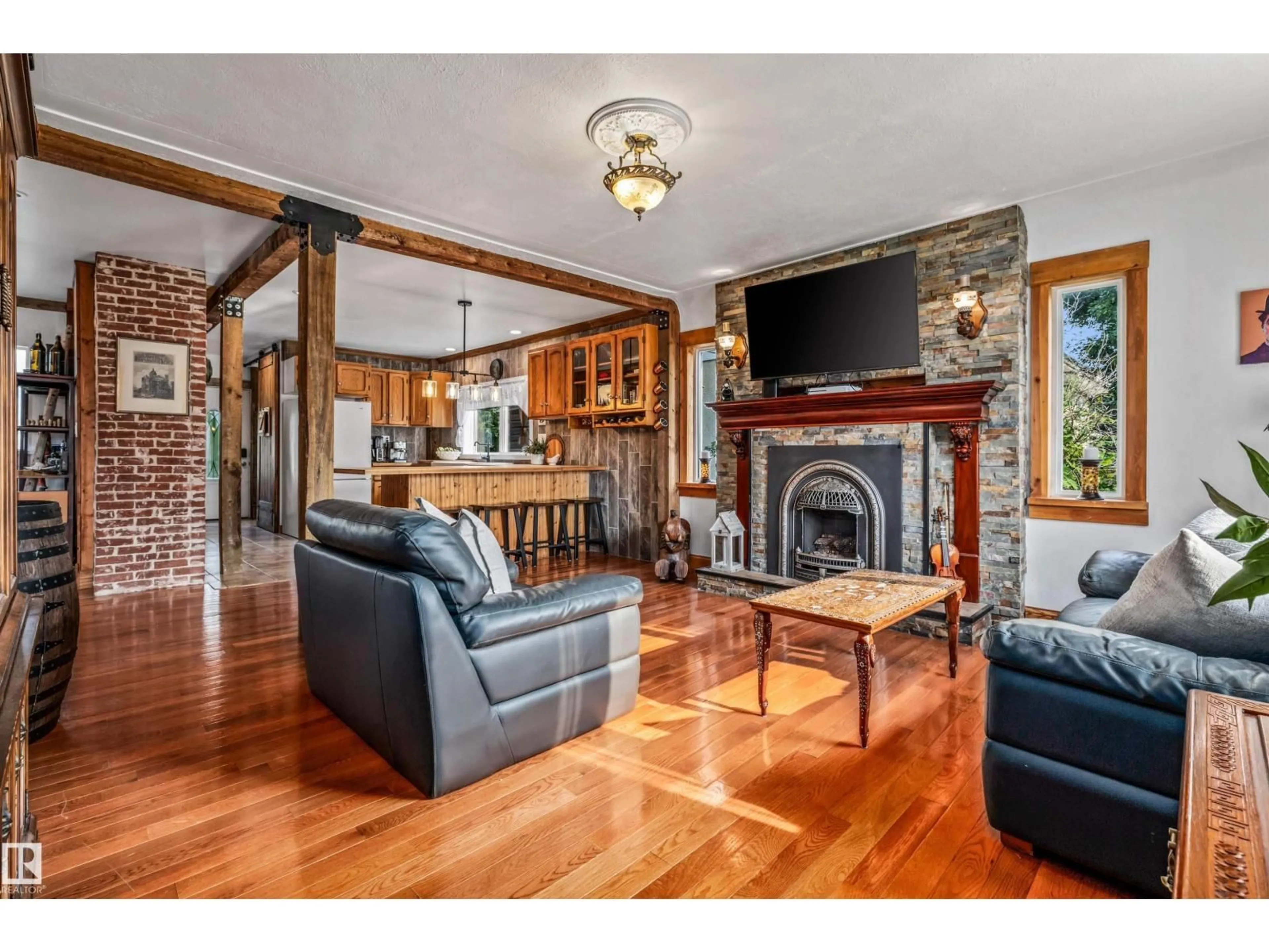 Living room with furniture, wood/laminate floor for 4917 50 ST, Bruderheim Alberta T0B0S0