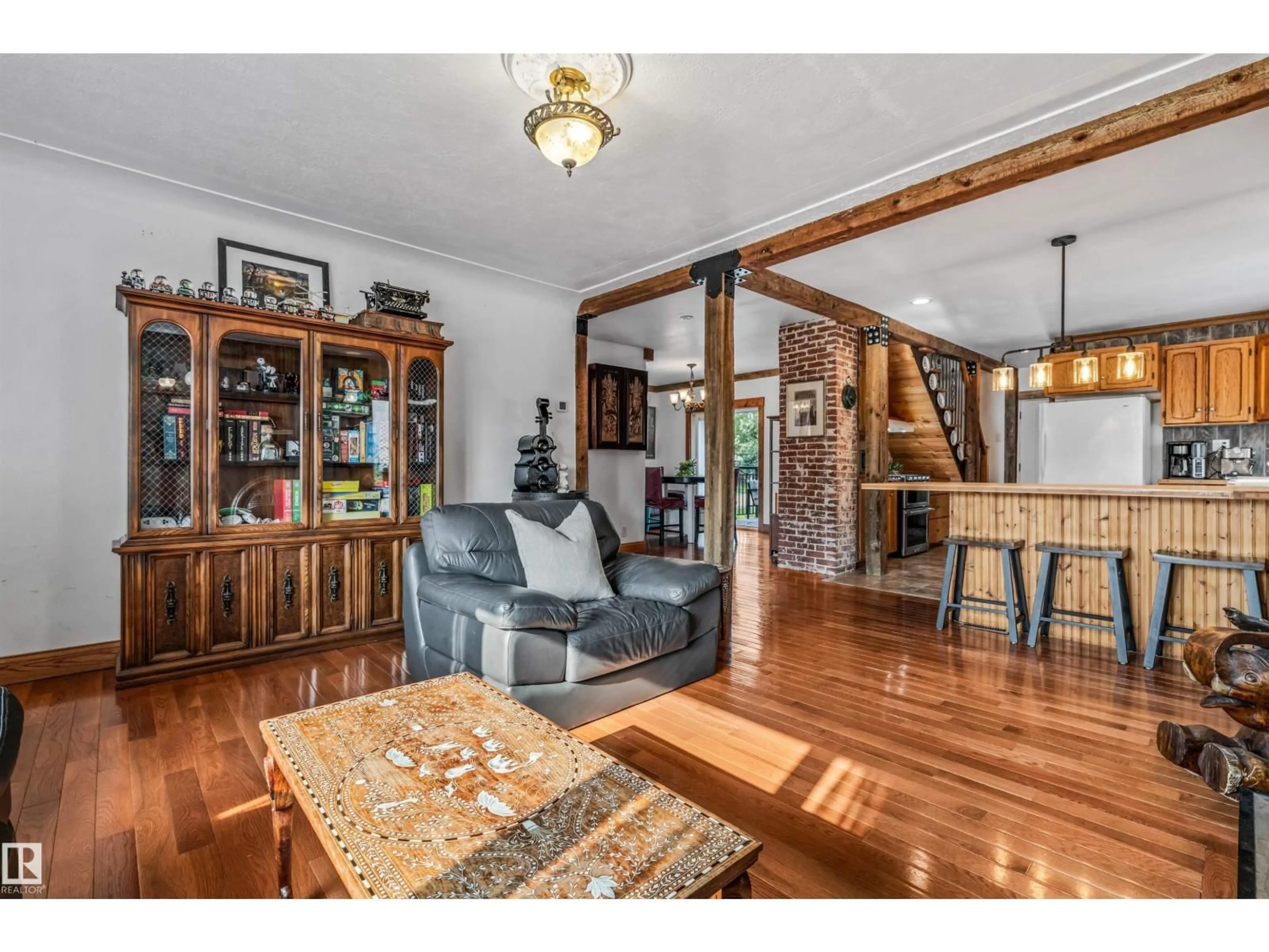 Living room with furniture, wood/laminate floor for 4917 50 ST, Bruderheim Alberta T0B0S0