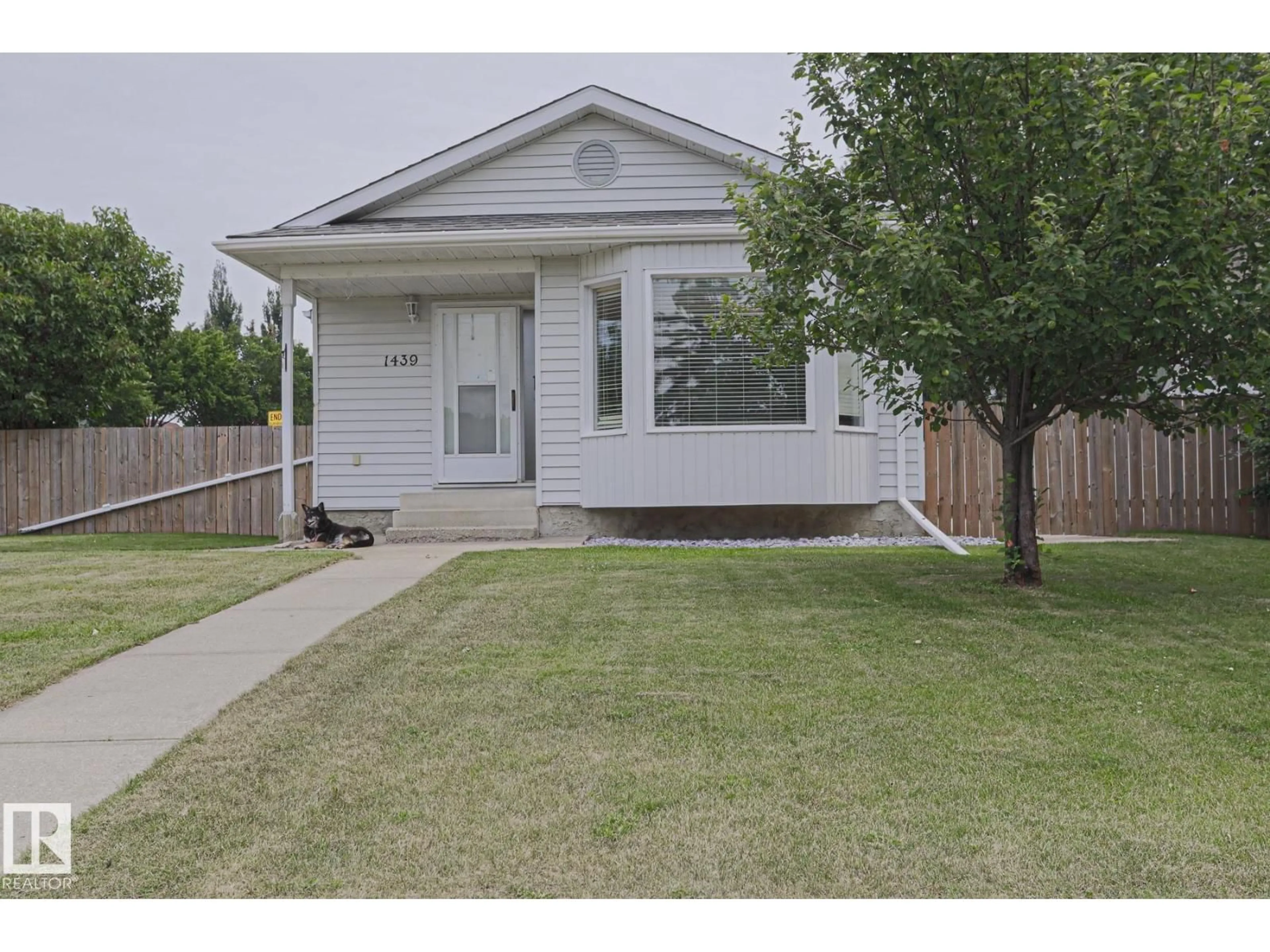 Home with vinyl exterior material, street for NW - 1439 80 ST, Edmonton Alberta T6K2R3