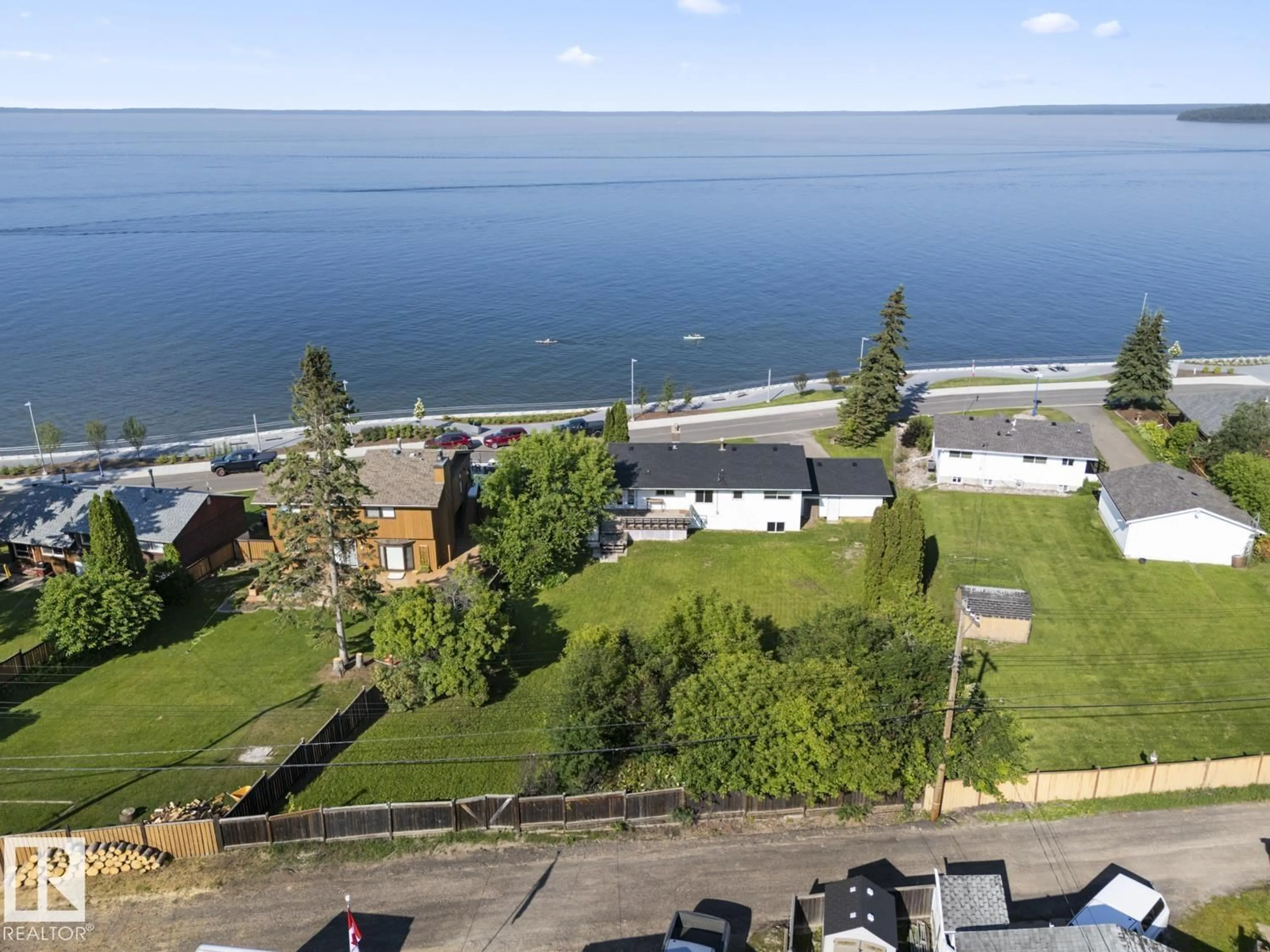 A pic from outside/outdoor area/front of a property/back of a property/a pic from drone, water/lake/river/ocean view for 315 LAKESHORE DR, Cold Lake Alberta T9M1A3