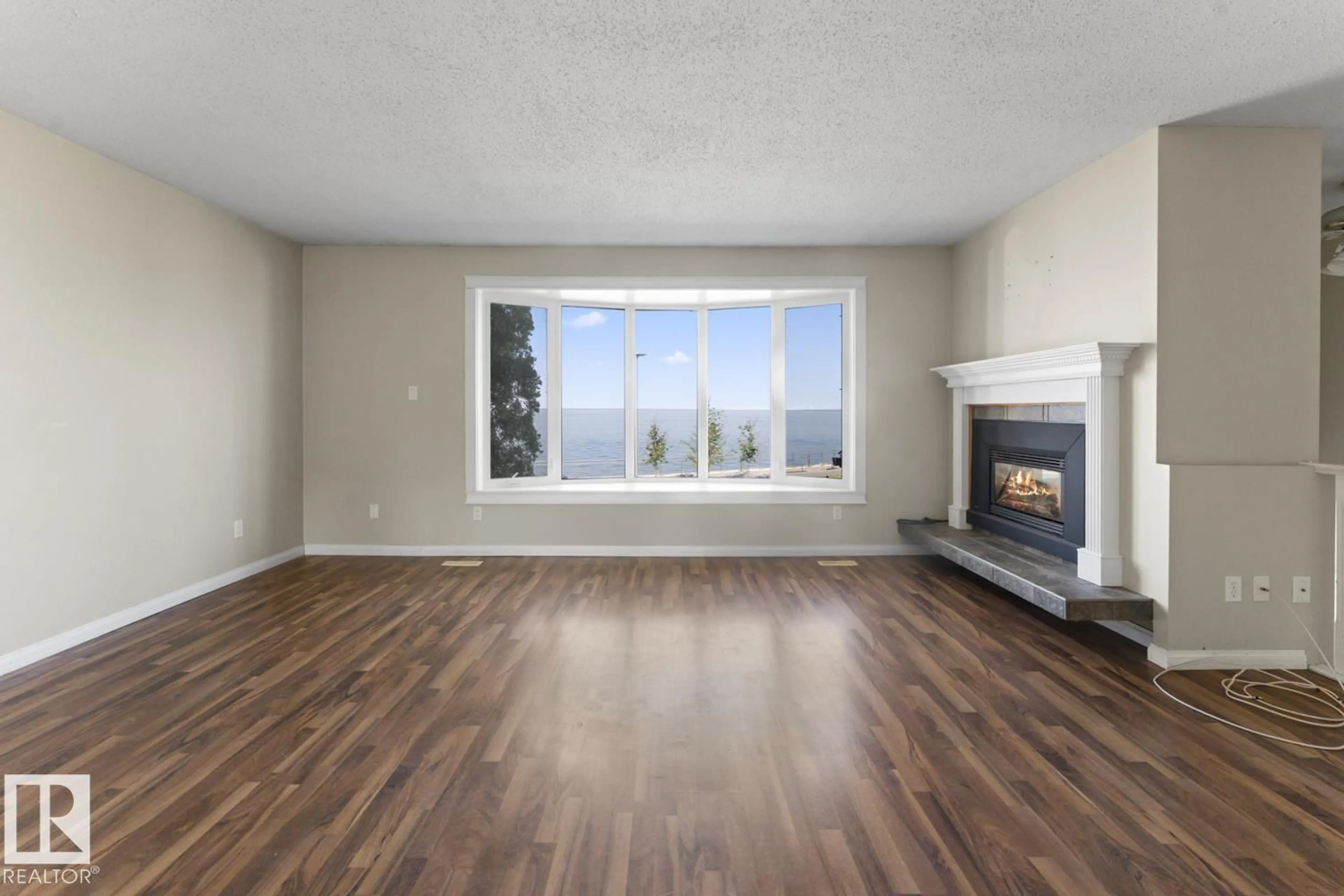 Living room with furniture, wood/laminate floor for 315 LAKESHORE DR, Cold Lake Alberta T9M1A3