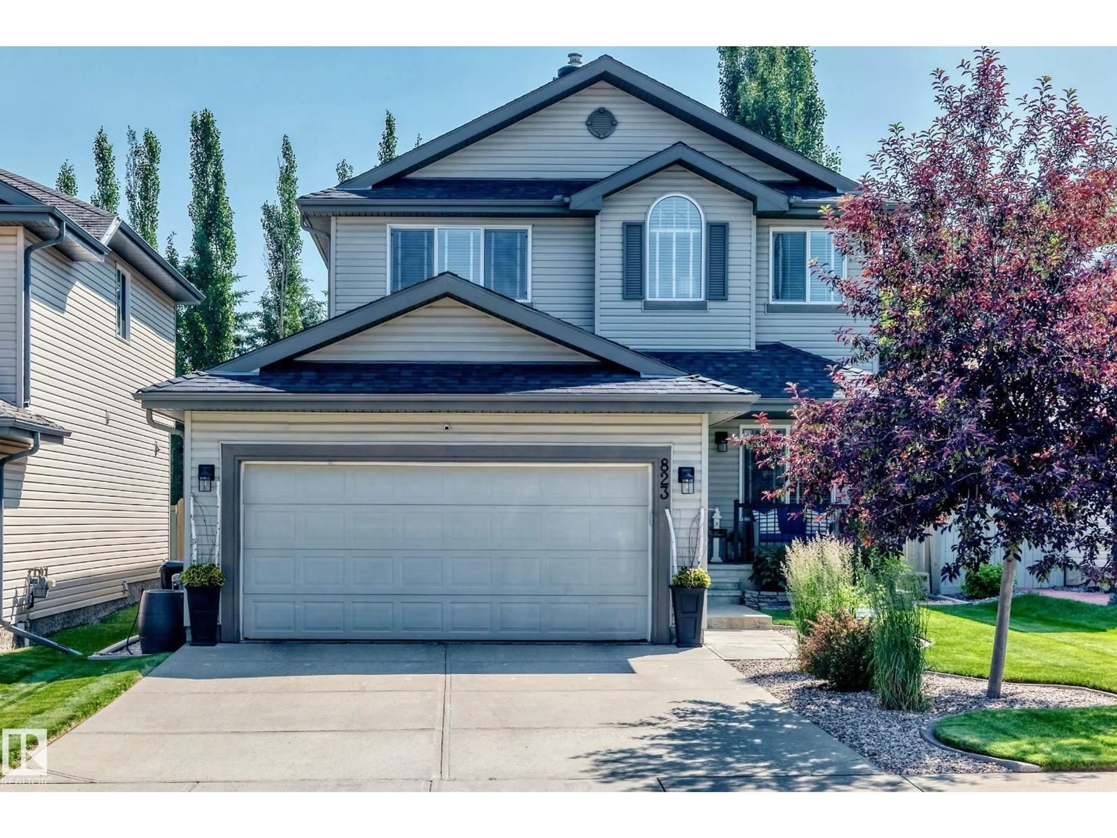 Home with vinyl exterior material, street for SW SW - 823 77 ST, Edmonton Alberta T6X0A3