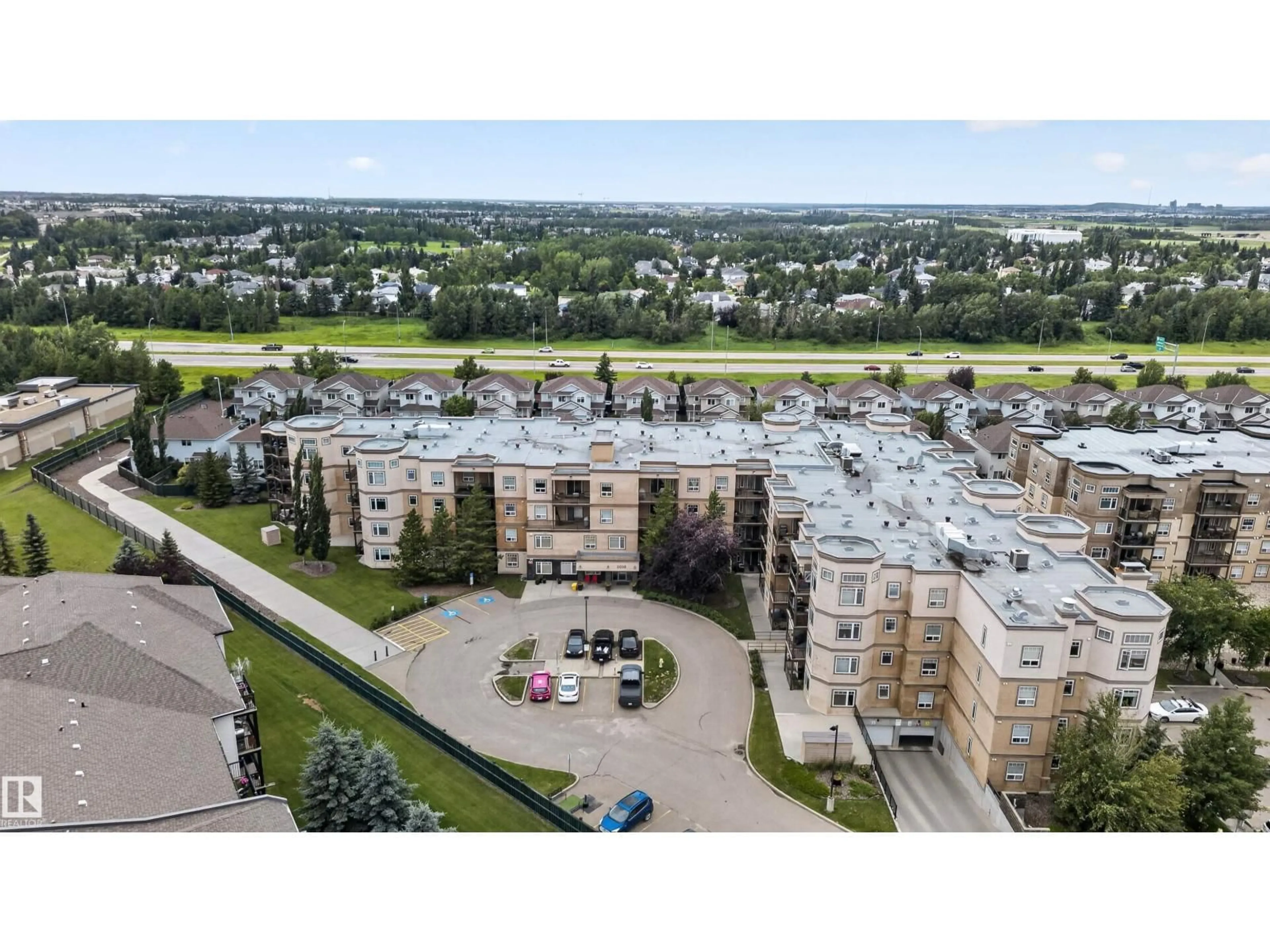 A pic from outside/outdoor area/front of a property/back of a property/a pic from drone, unknown for #212 - 2035 GRANTHAM CT, Edmonton Alberta T5T3X4
