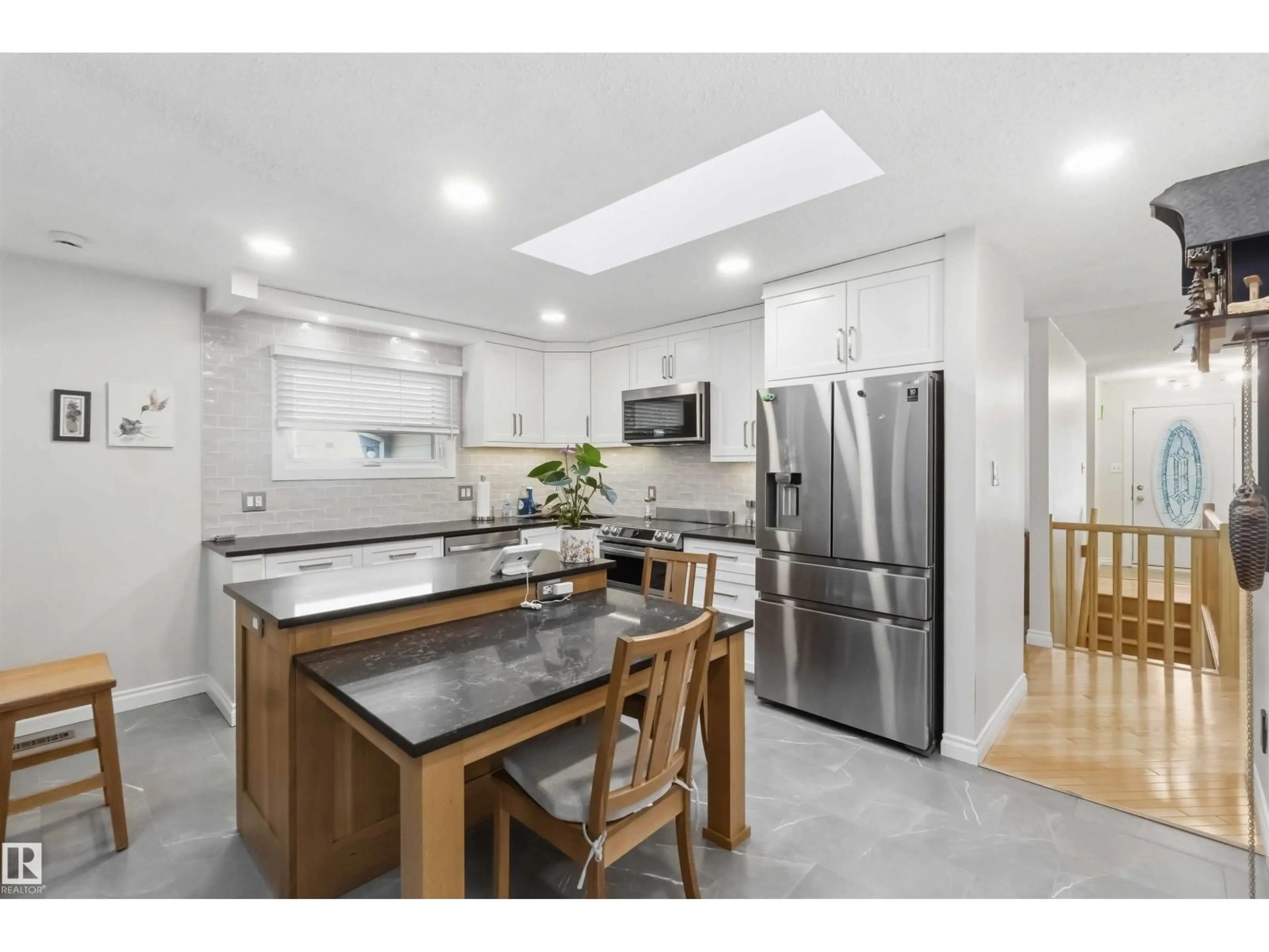 Open concept kitchen, ceramic/tile floor for 31 GARIEPY CR, Edmonton Alberta T6M1B5
