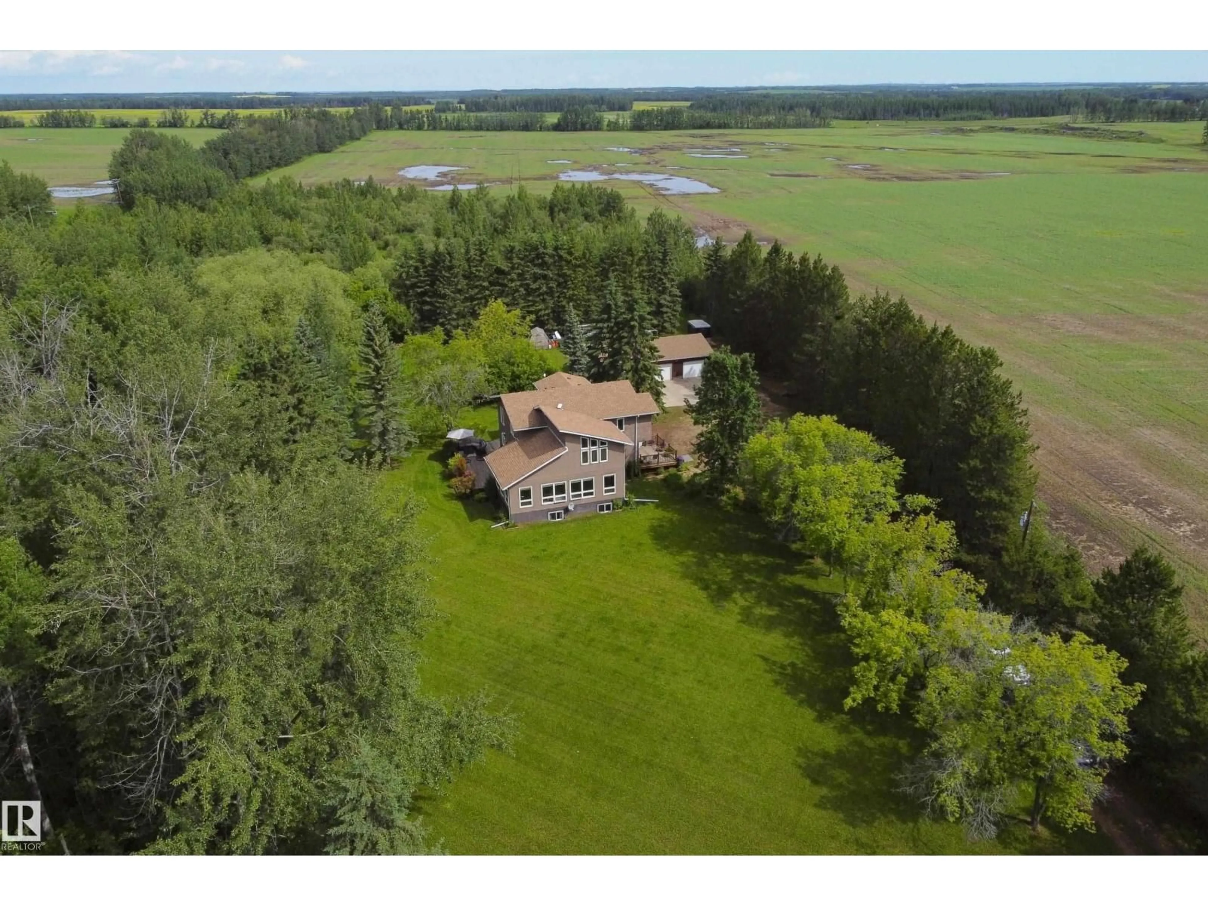 A pic from outside/outdoor area/front of a property/back of a property/a pic from drone, water/lake/river/ocean view for 4314 TWP RD 610, Rural Barrhead County Alberta T7N1N2
