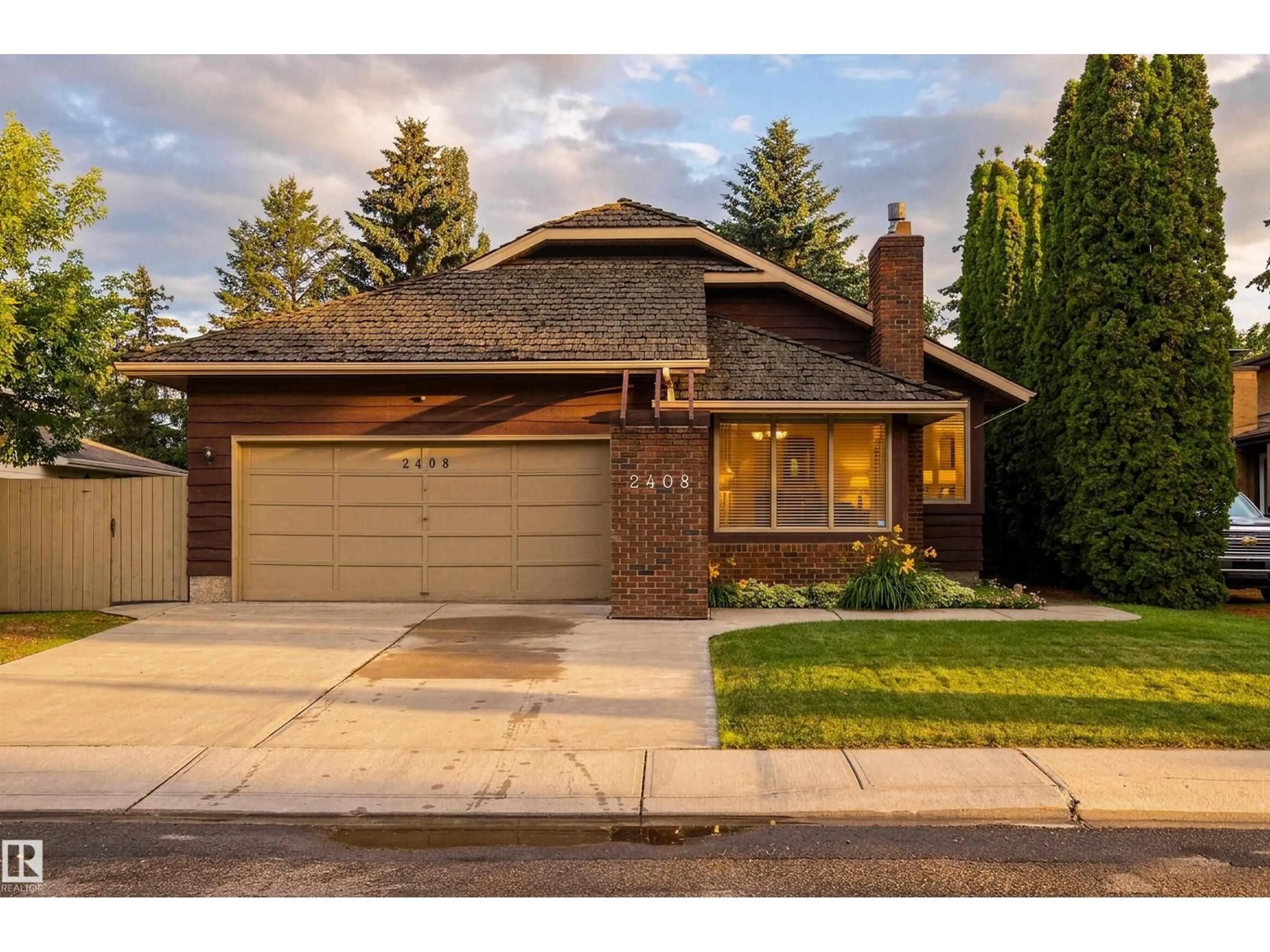 Home with brick exterior material, street for NW - 2408 115 ST, Edmonton Alberta T6J3S1