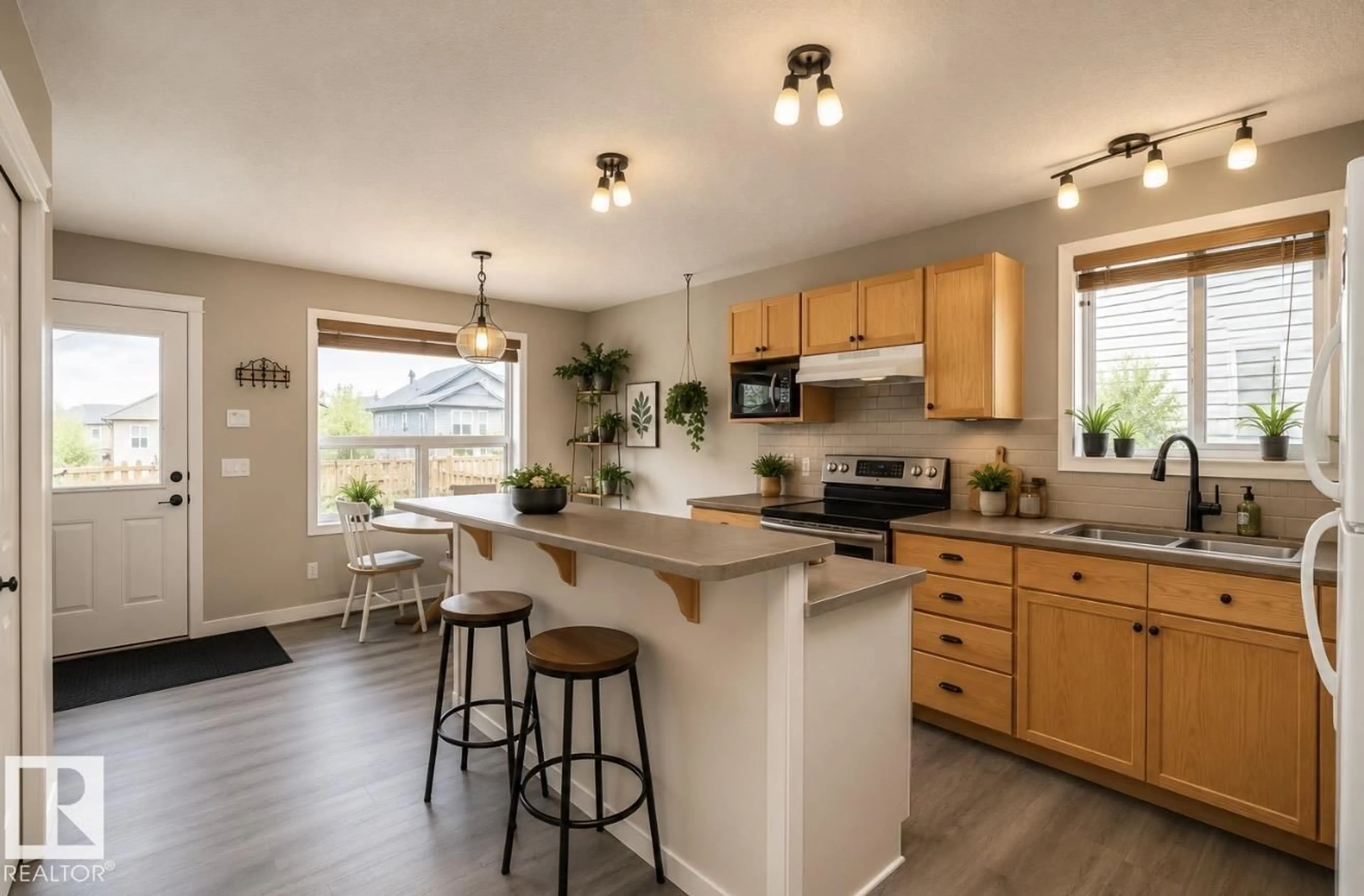 Open concept kitchen, wood/laminate floor for NW - 17908 89 ST, Edmonton Alberta T5Z0A6
