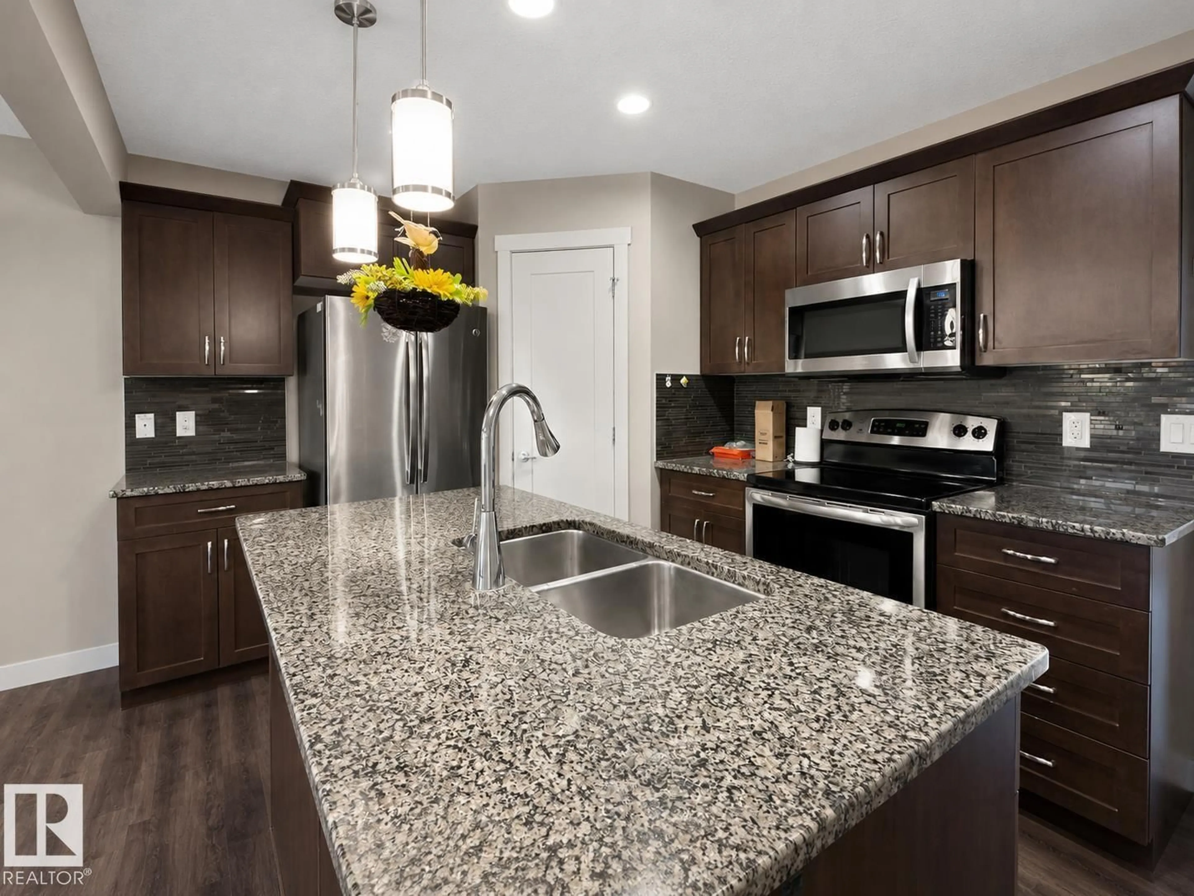 Open concept kitchen, ceramic/tile floor for 20312 42 AV, Edmonton Alberta T6M0R8