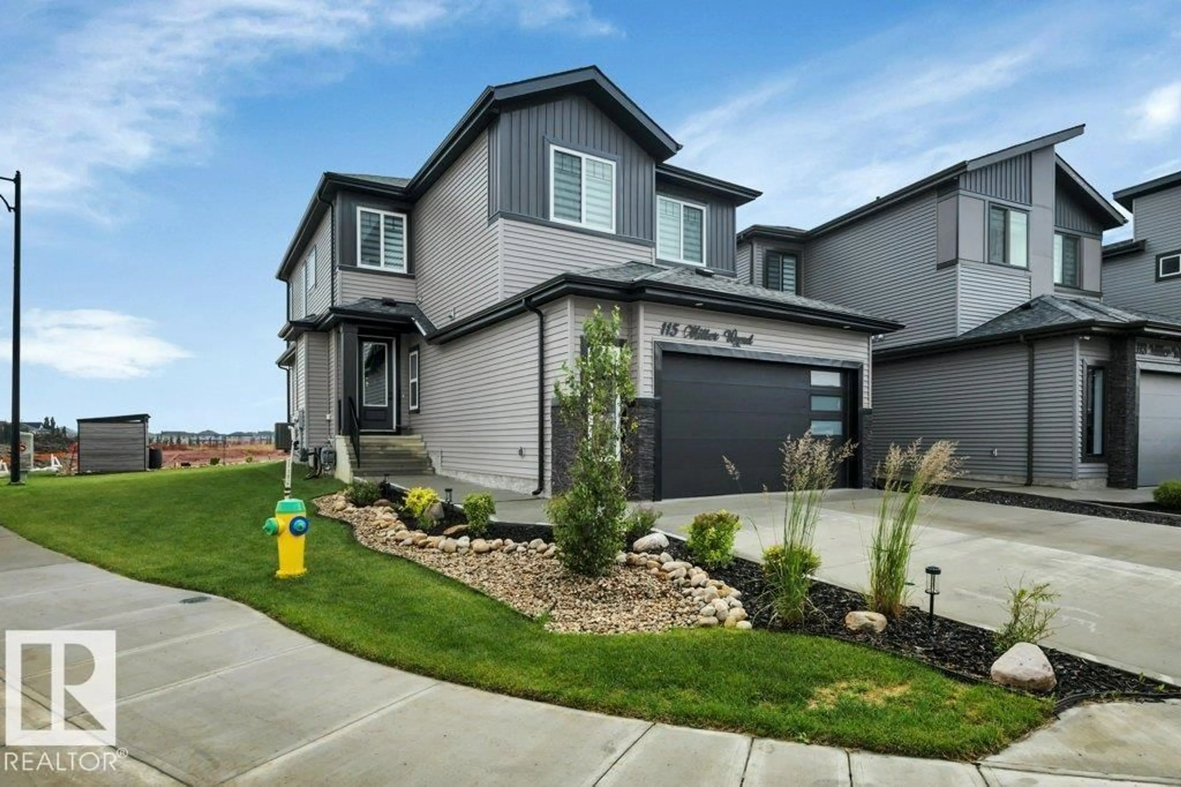 Home with vinyl exterior material, street for 115 MILLER WD, Leduc Alberta T9E1R7