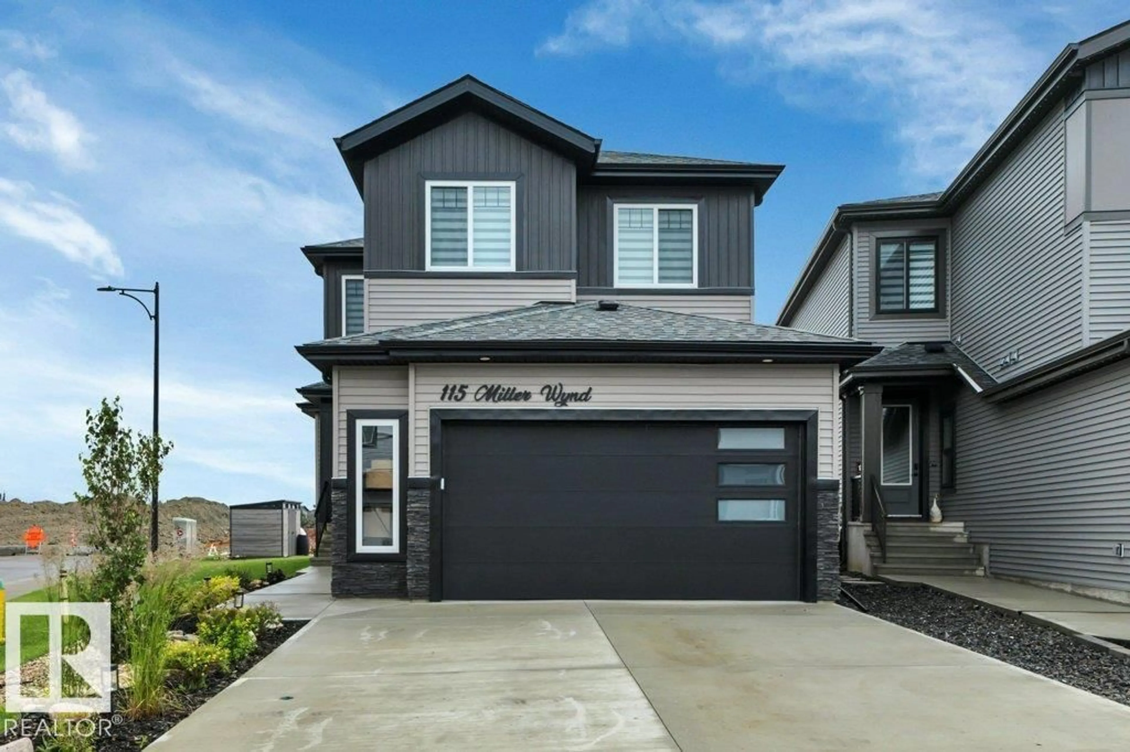 Home with vinyl exterior material, street for 115 MILLER WD, Leduc Alberta T9E1R7