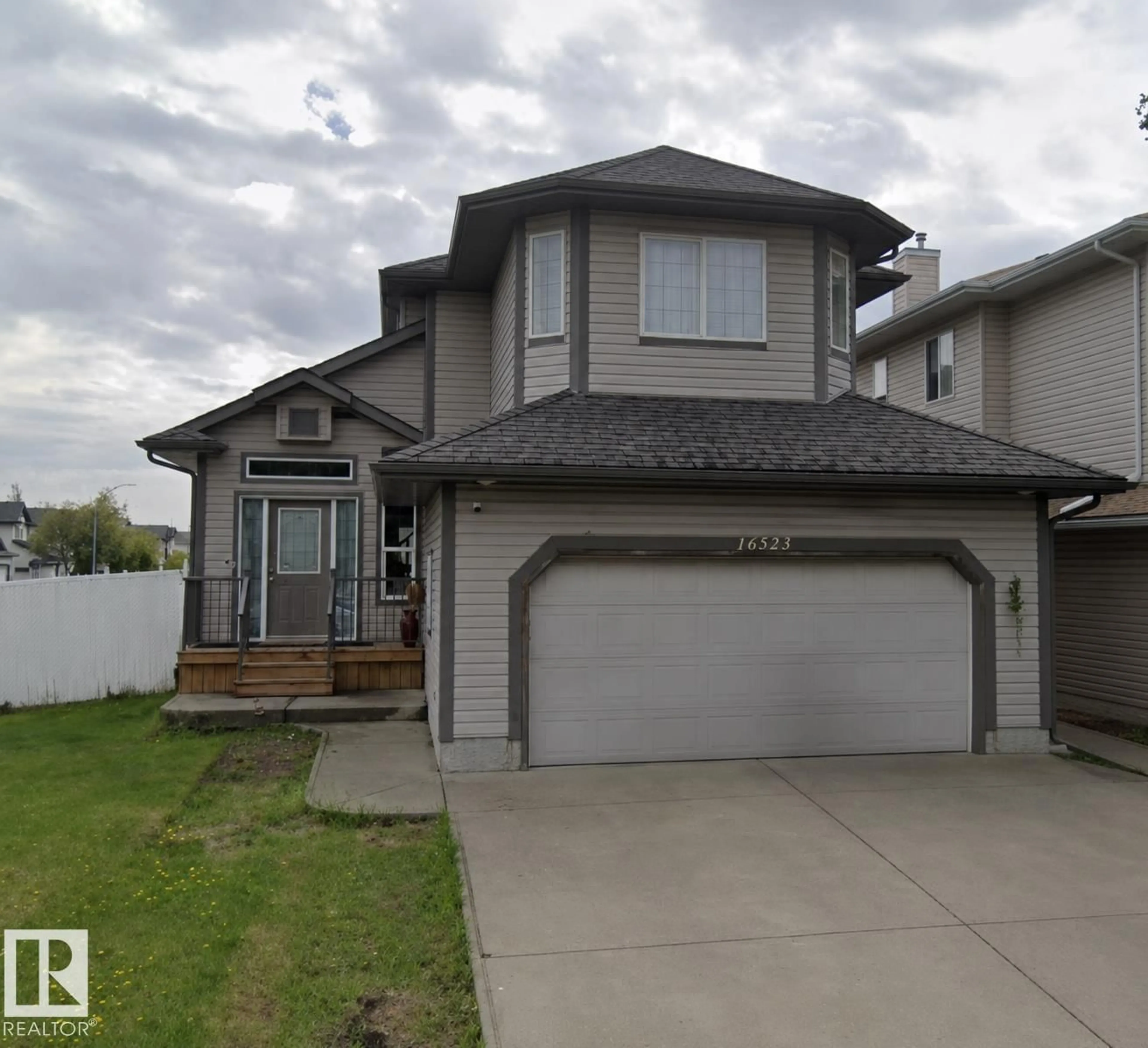 Home with vinyl exterior material, street for NW - 16523 89 ST, Edmonton Alberta T5Z3W8