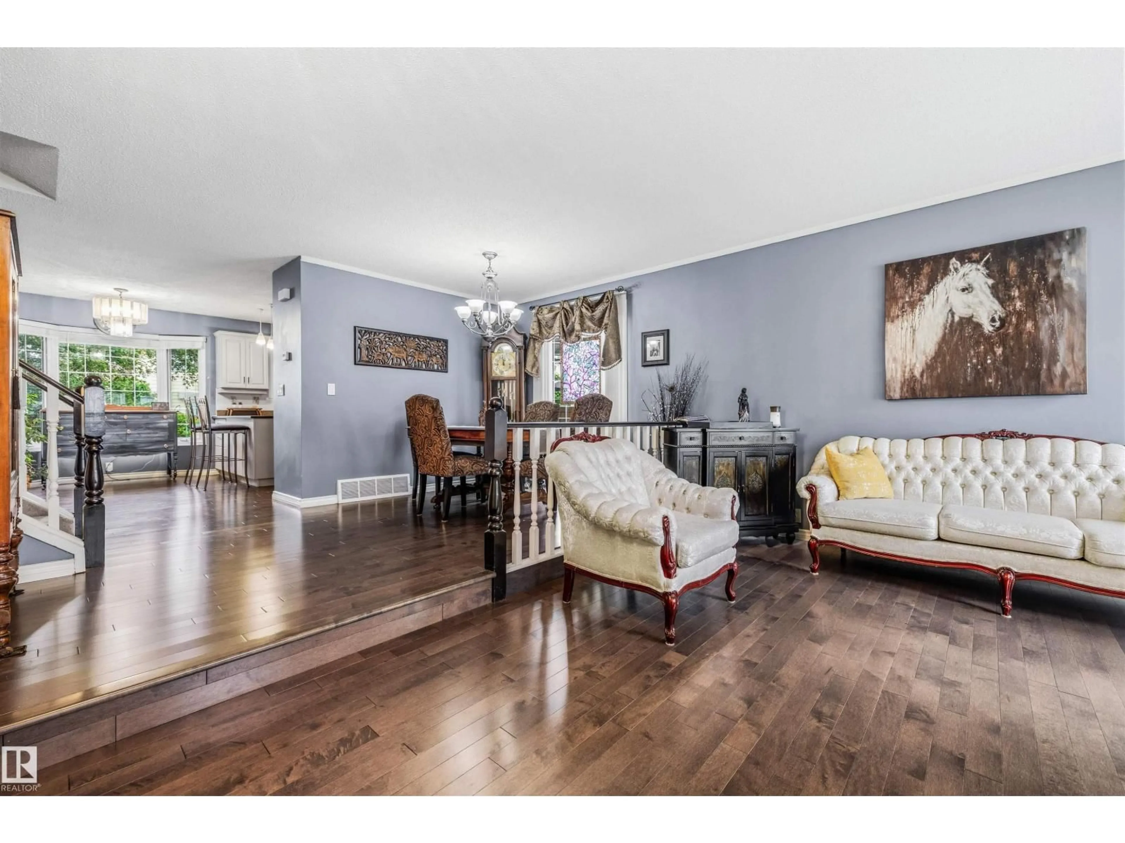 Living room with furniture, wood/laminate floor for NW - 15915 112 ST, Edmonton Alberta T5X4S7