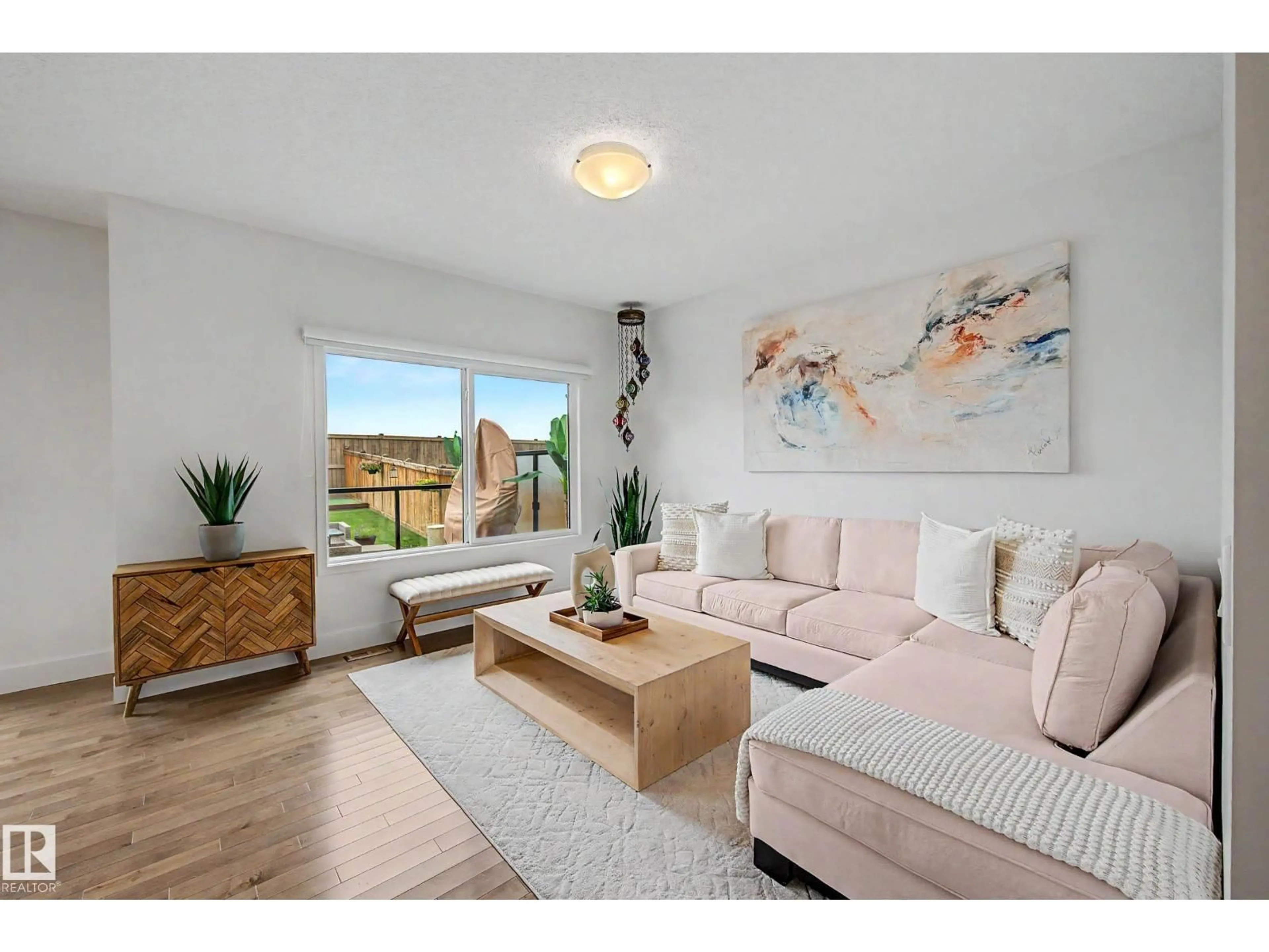 Living room with furniture, wood/laminate floor for NW - 12120 177 AV, Edmonton Alberta T5X0L1