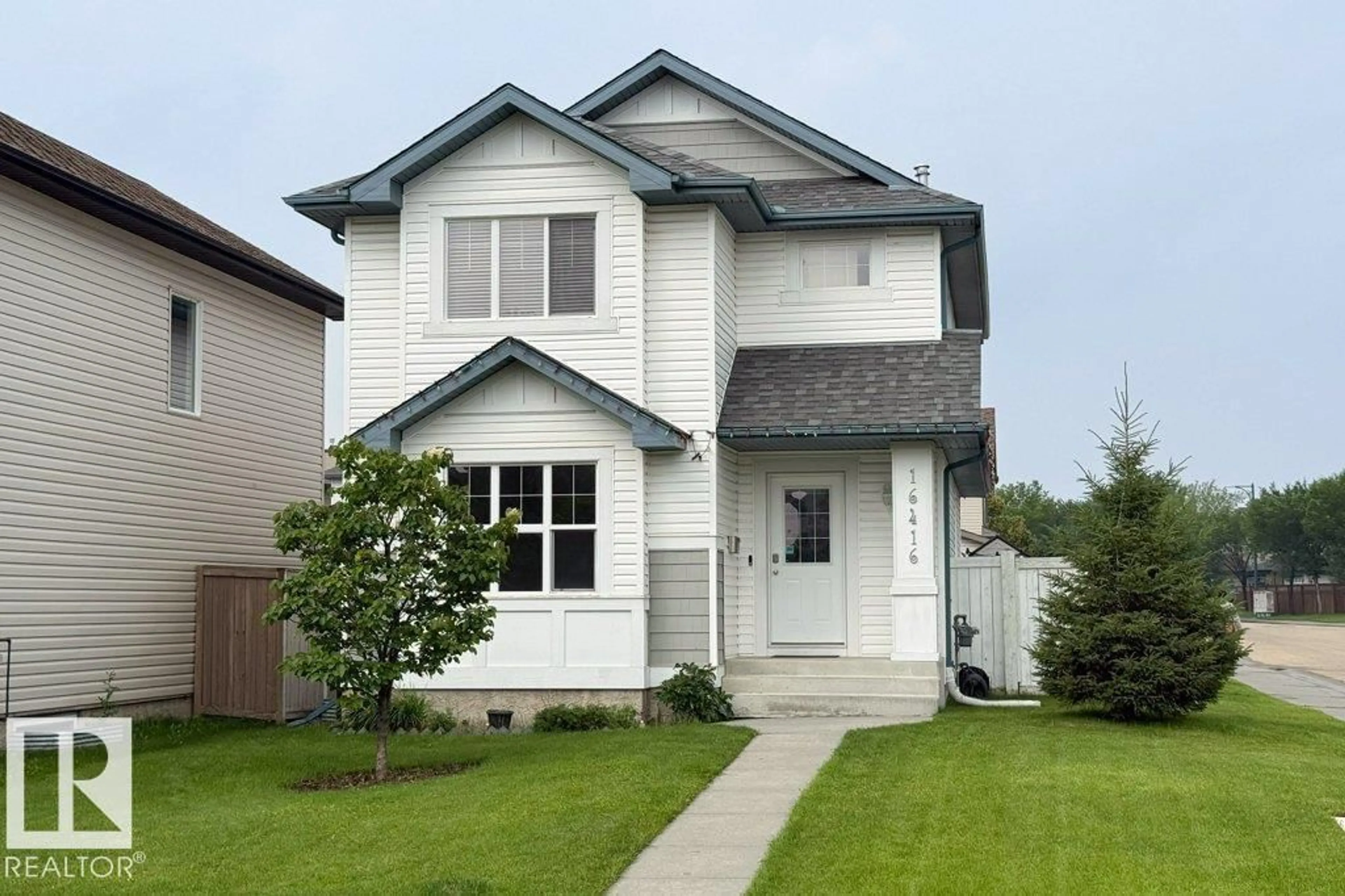 Home with vinyl exterior material, street for 16416 57 ST, Edmonton Alberta T5Y0A2