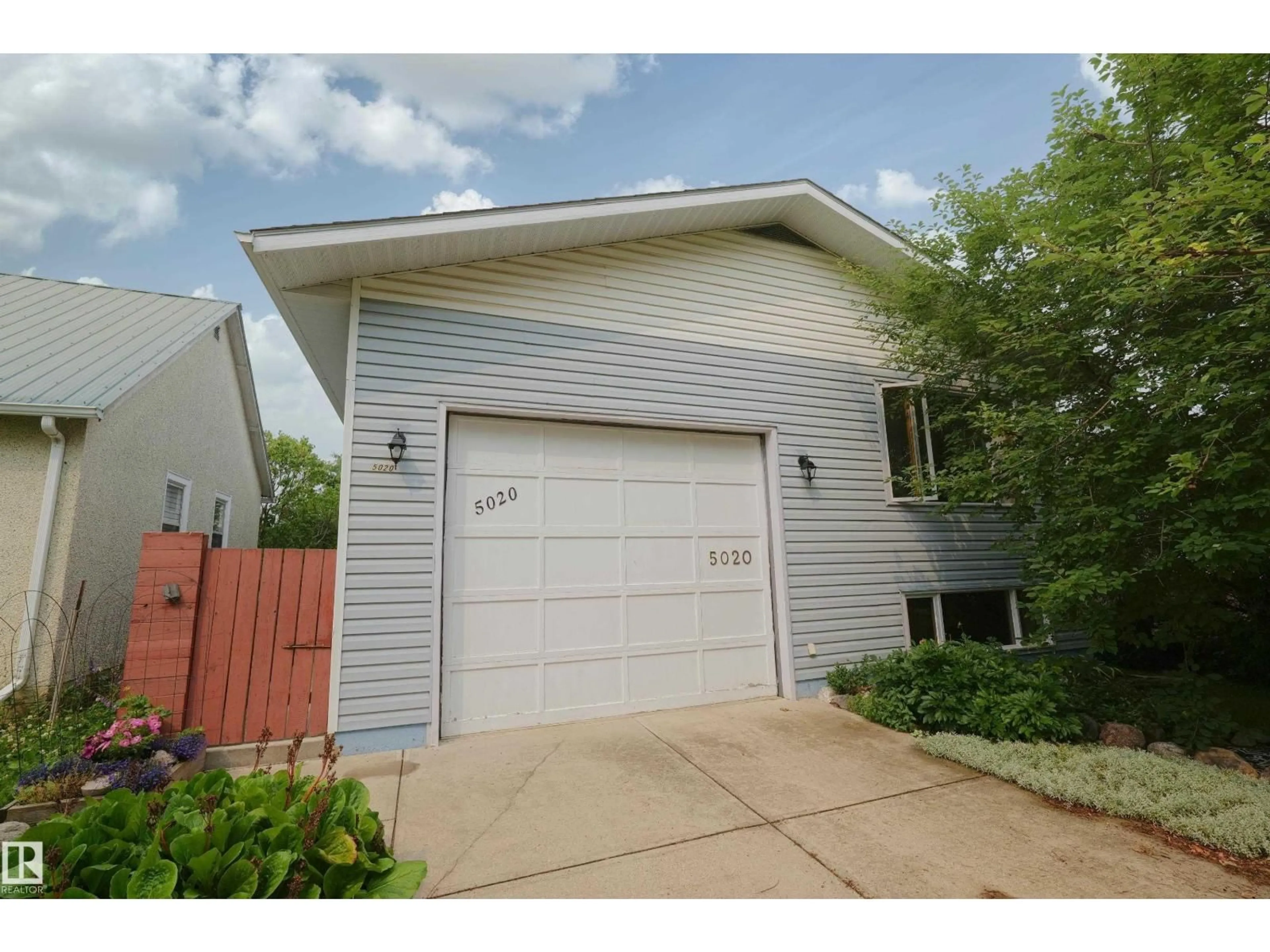 Home with vinyl exterior material, street for 5020 47 ST, Barrhead Alberta T7N1H5