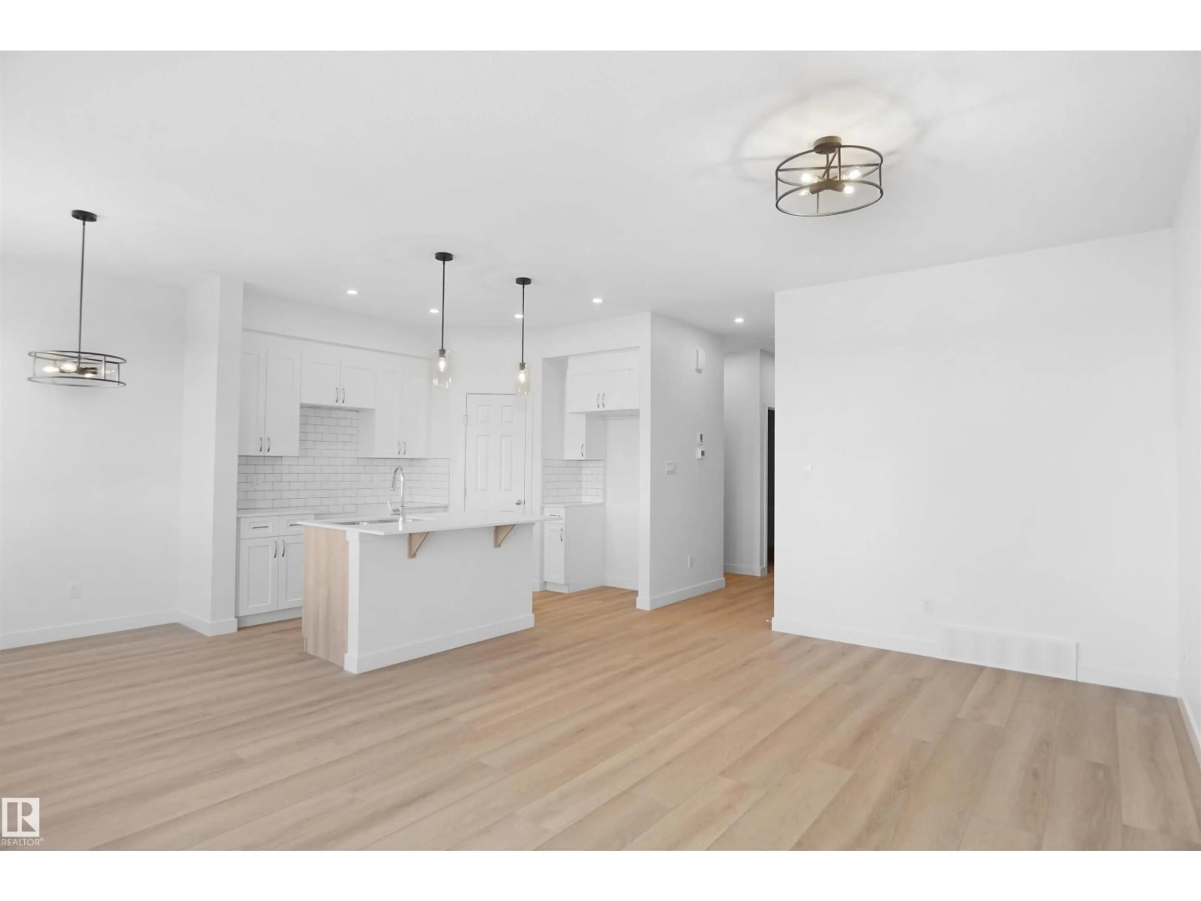 Open concept kitchen, wood/laminate floor for NW - 2128 210 ST, Edmonton Alberta T6W5G7